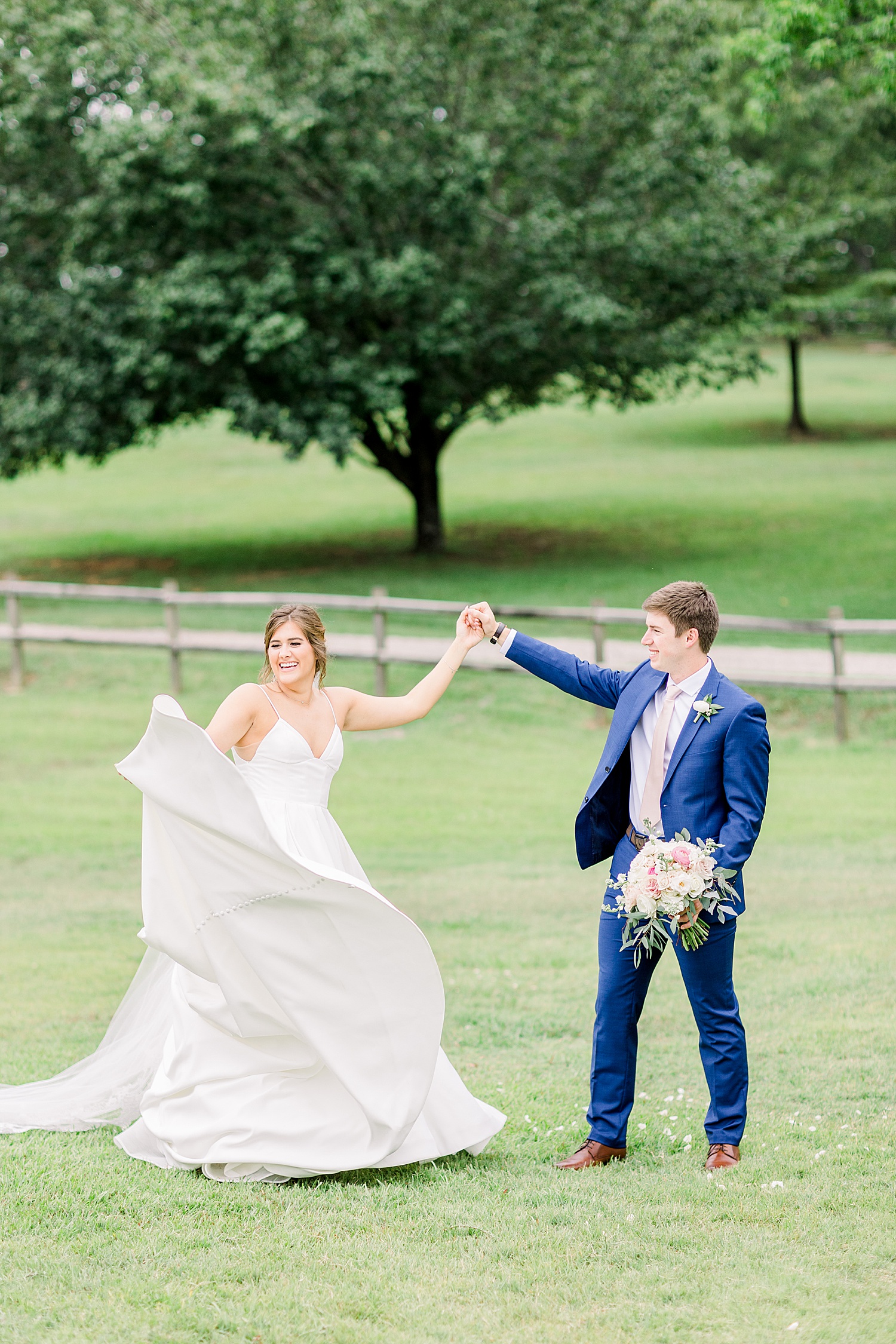 Husband and wife dance + Celebrate on the grounds of The Barn at Shady Lane in Birmingham AL