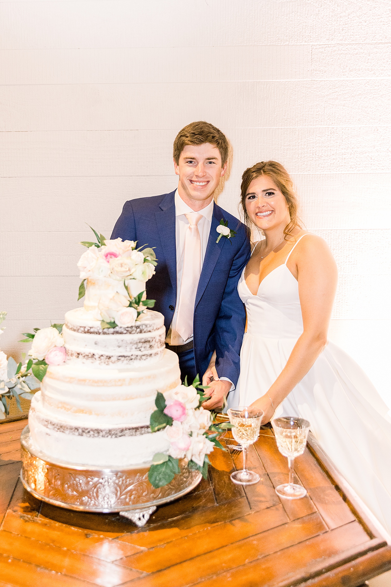 bride + groom cut wedding cake