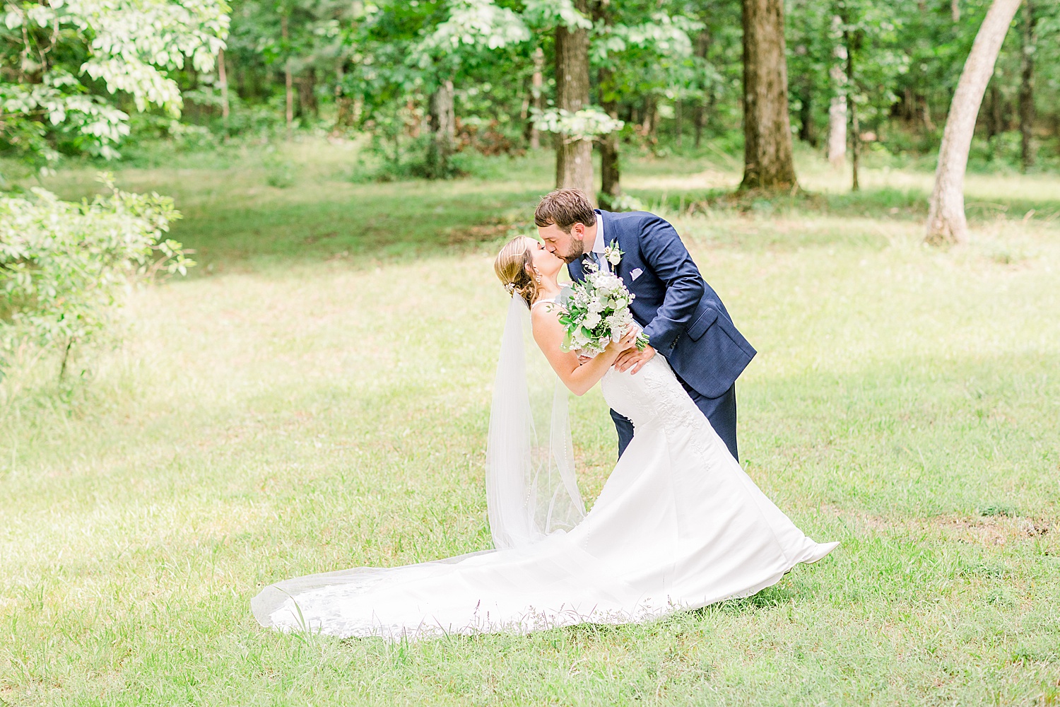 Newlyweds kiss after Belle Farm Summer Wedding by Chelsea Morton Photography