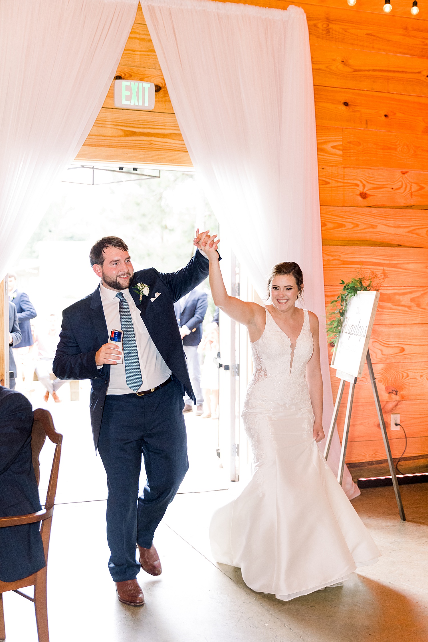 Bride + Groom make grand entrance to wedding reception at Belle Farms