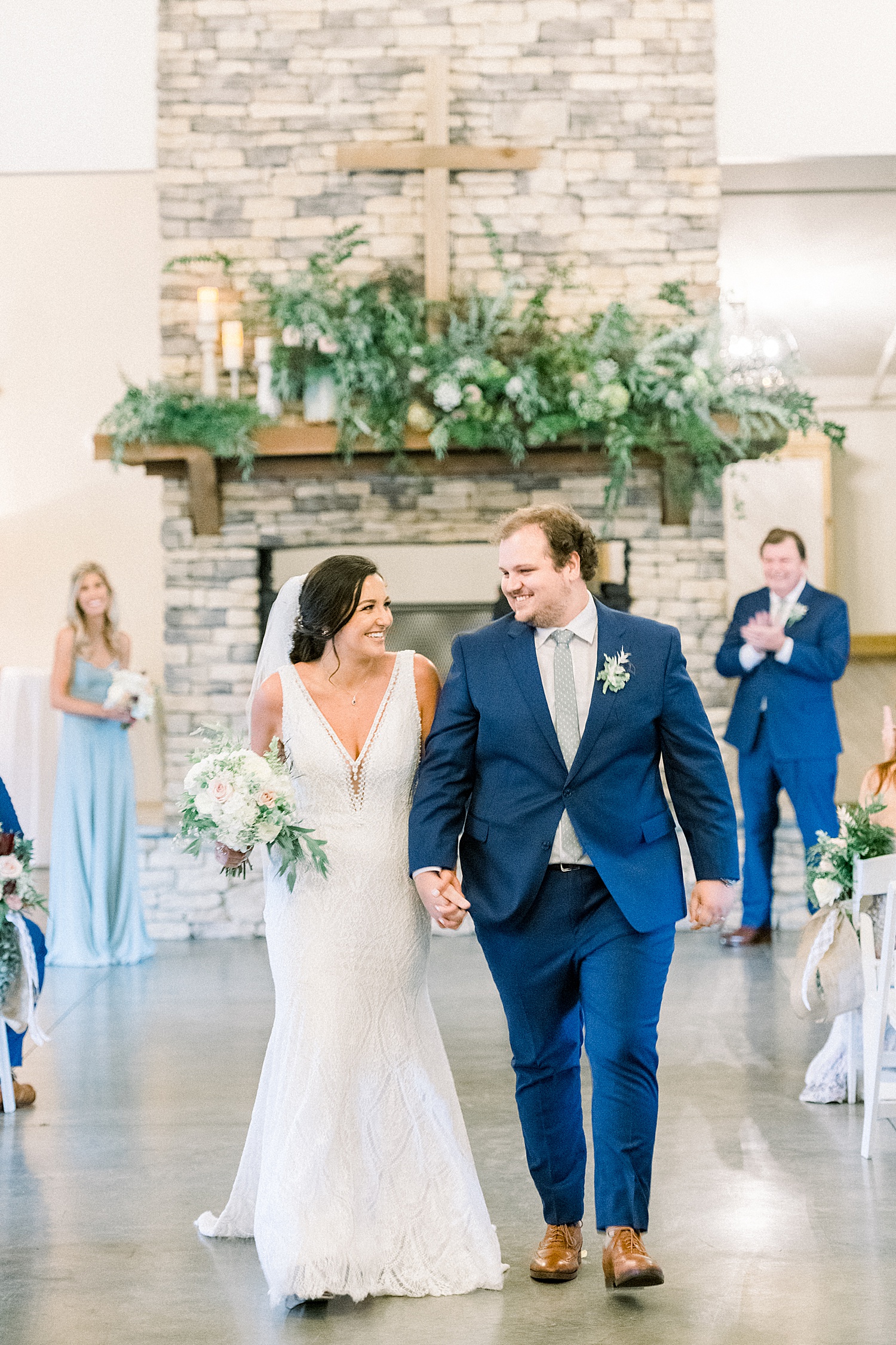 newlyweds walk down aisle as husband and wife at Park Crest Events Wedding