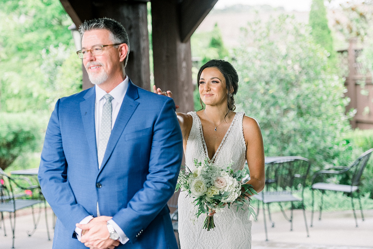 bride tapping her dad's shoulder for First look