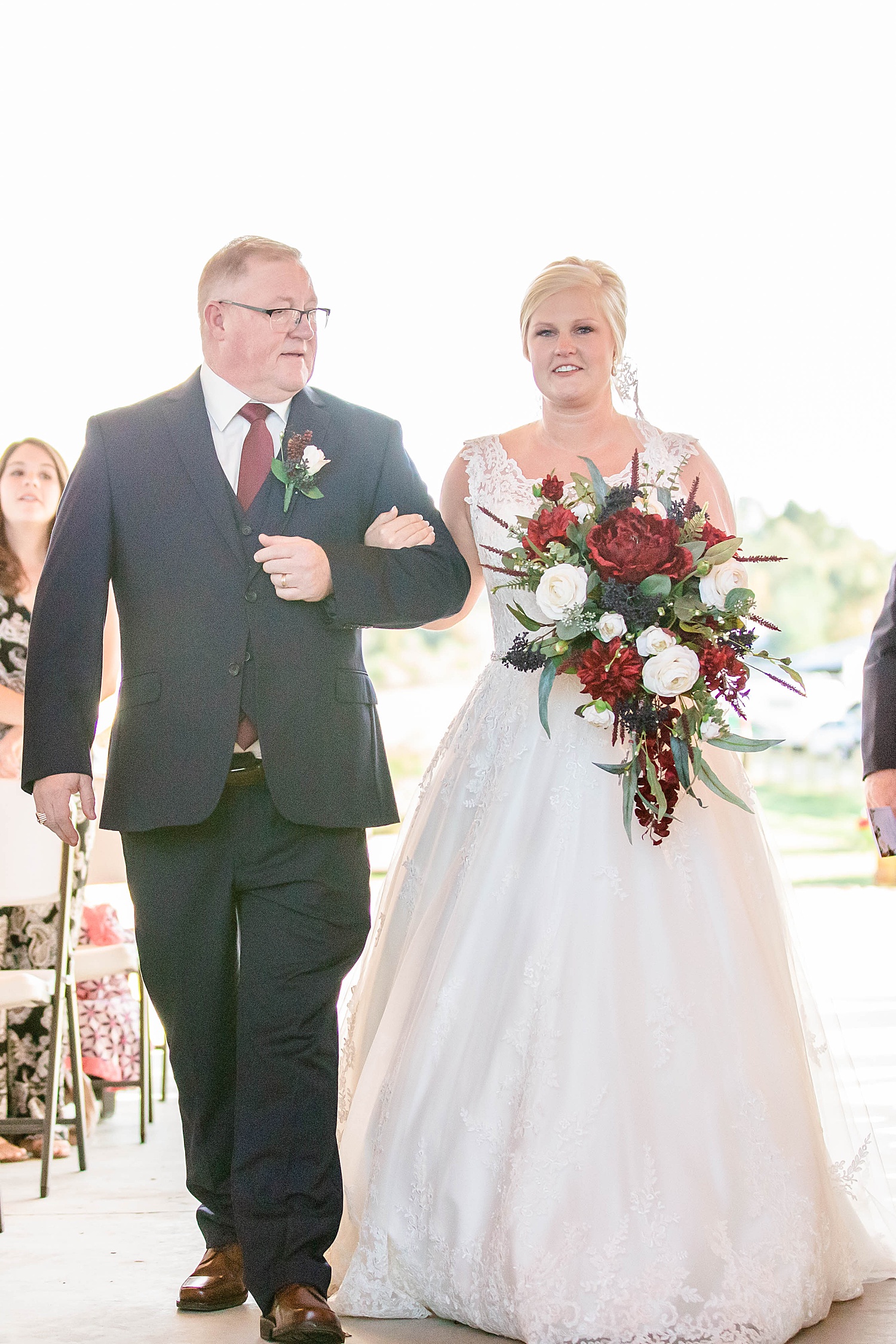 dad walks his daughter down the aisle at AL wedding