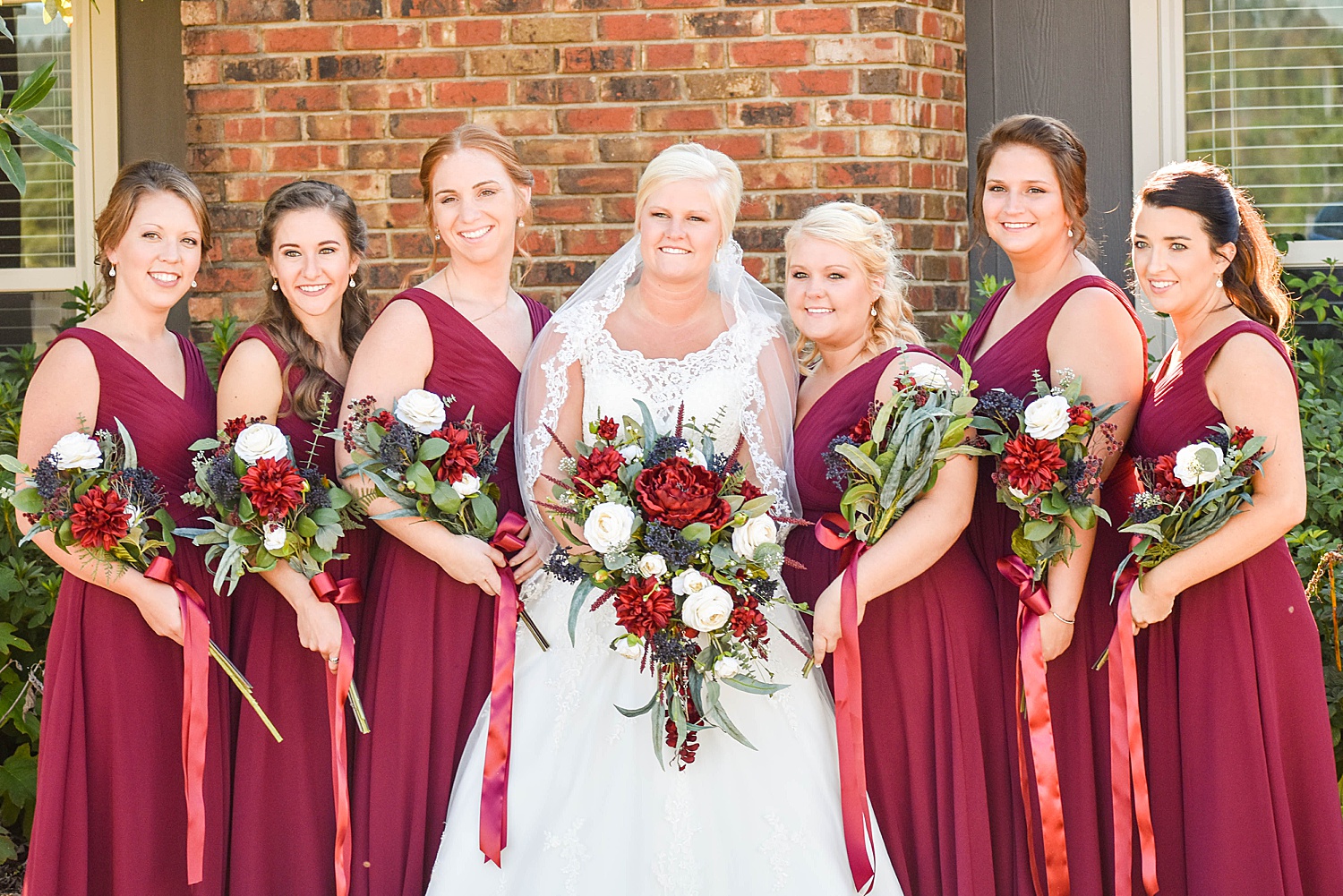 bride and bridesmaids in scarlet red