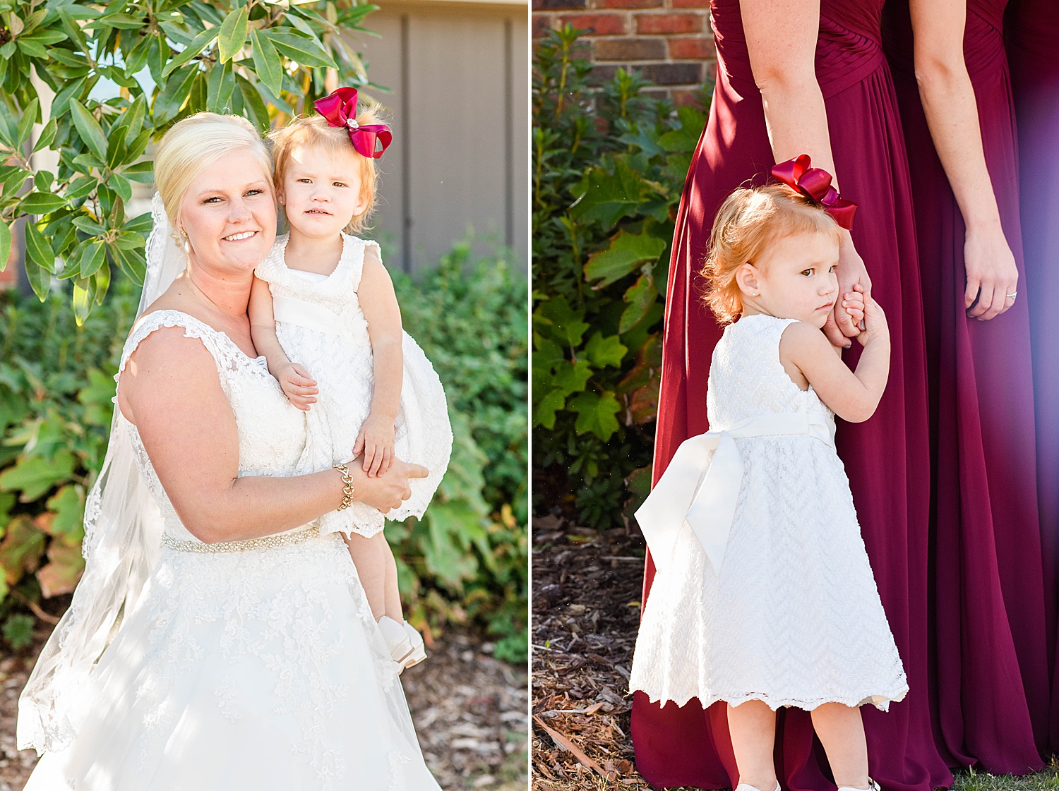 bride holds flower girl with red matching bow