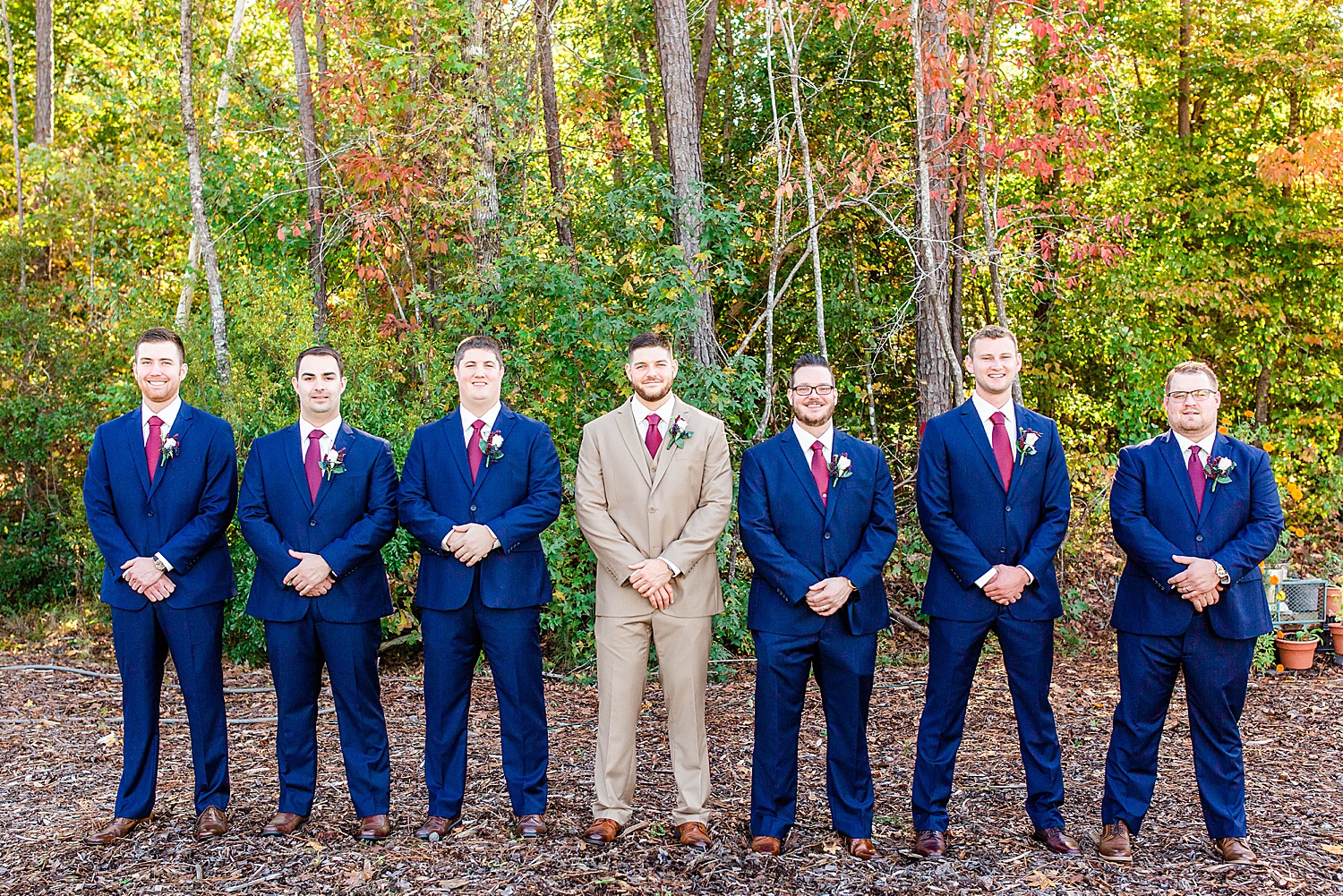 Groom and Groomsmen stand together after wedding ceremony