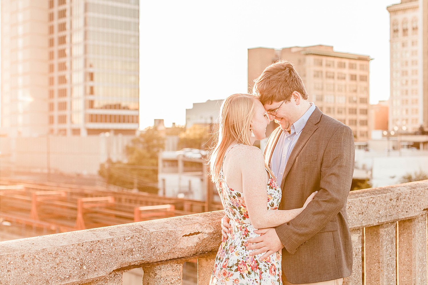 couple on rooftop as the sun sets