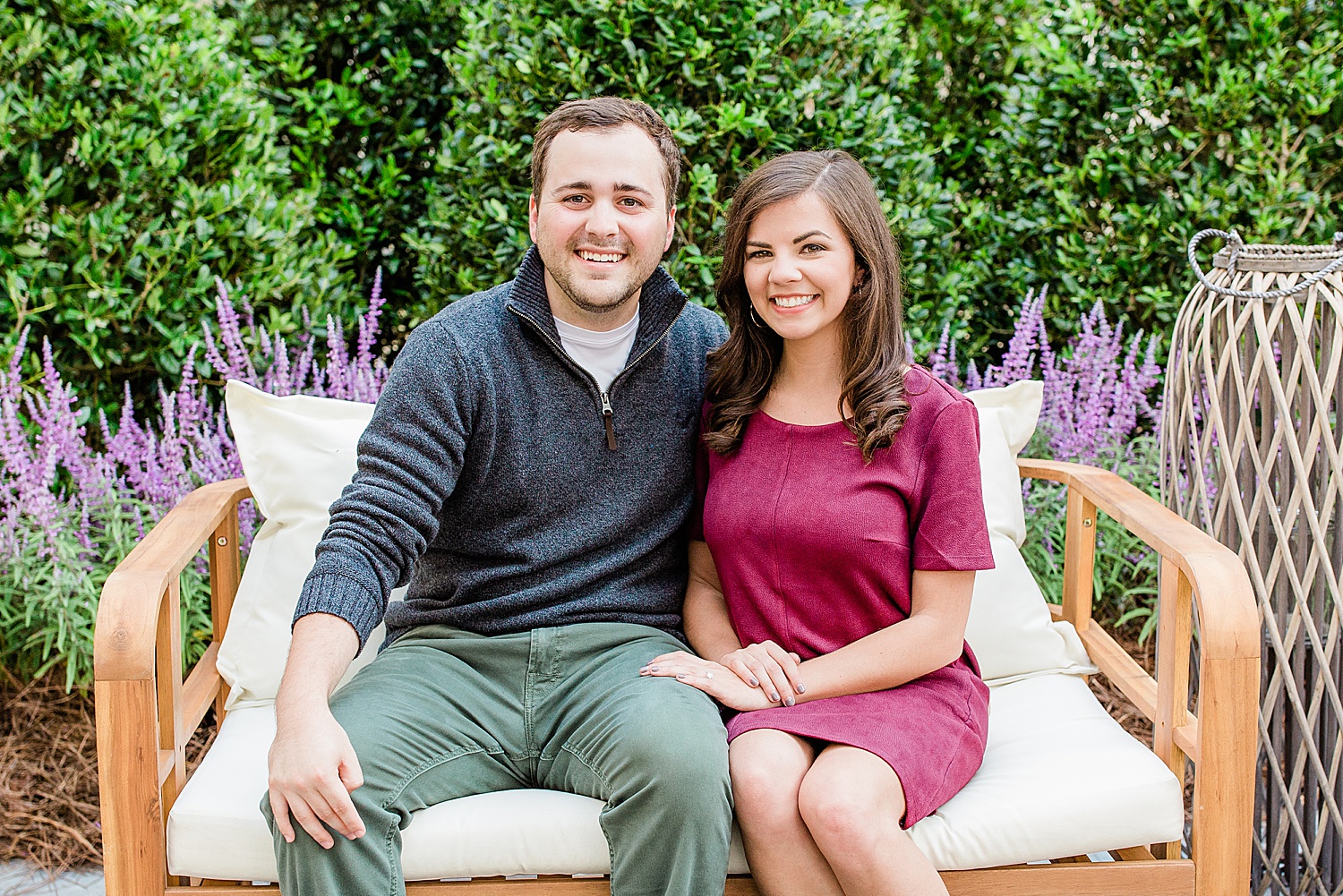 Couple sit on bench at Botanical Gardens Engagement Session in Downtown Birmingham