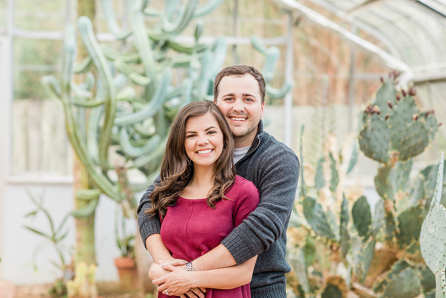 couple hug with green cactus in background