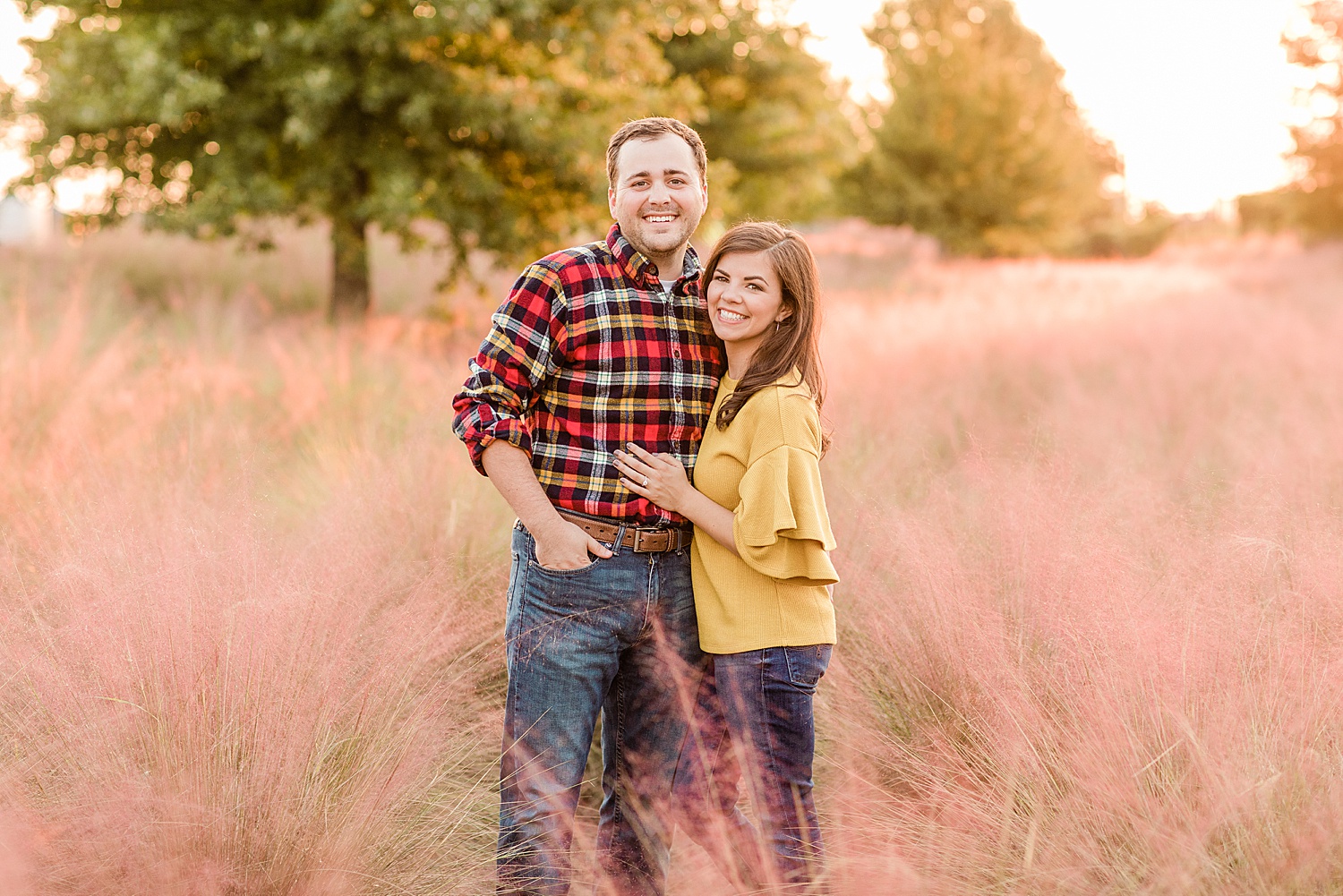 Fall engagement photos in tall grass at Railroad Park in AL