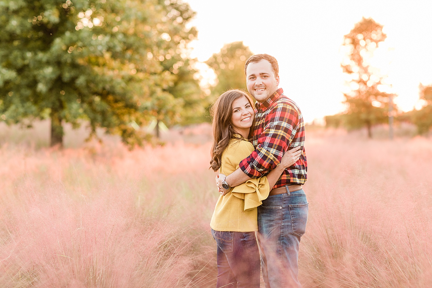 couple hug during golden hour in Downtown Birmingham engagement session