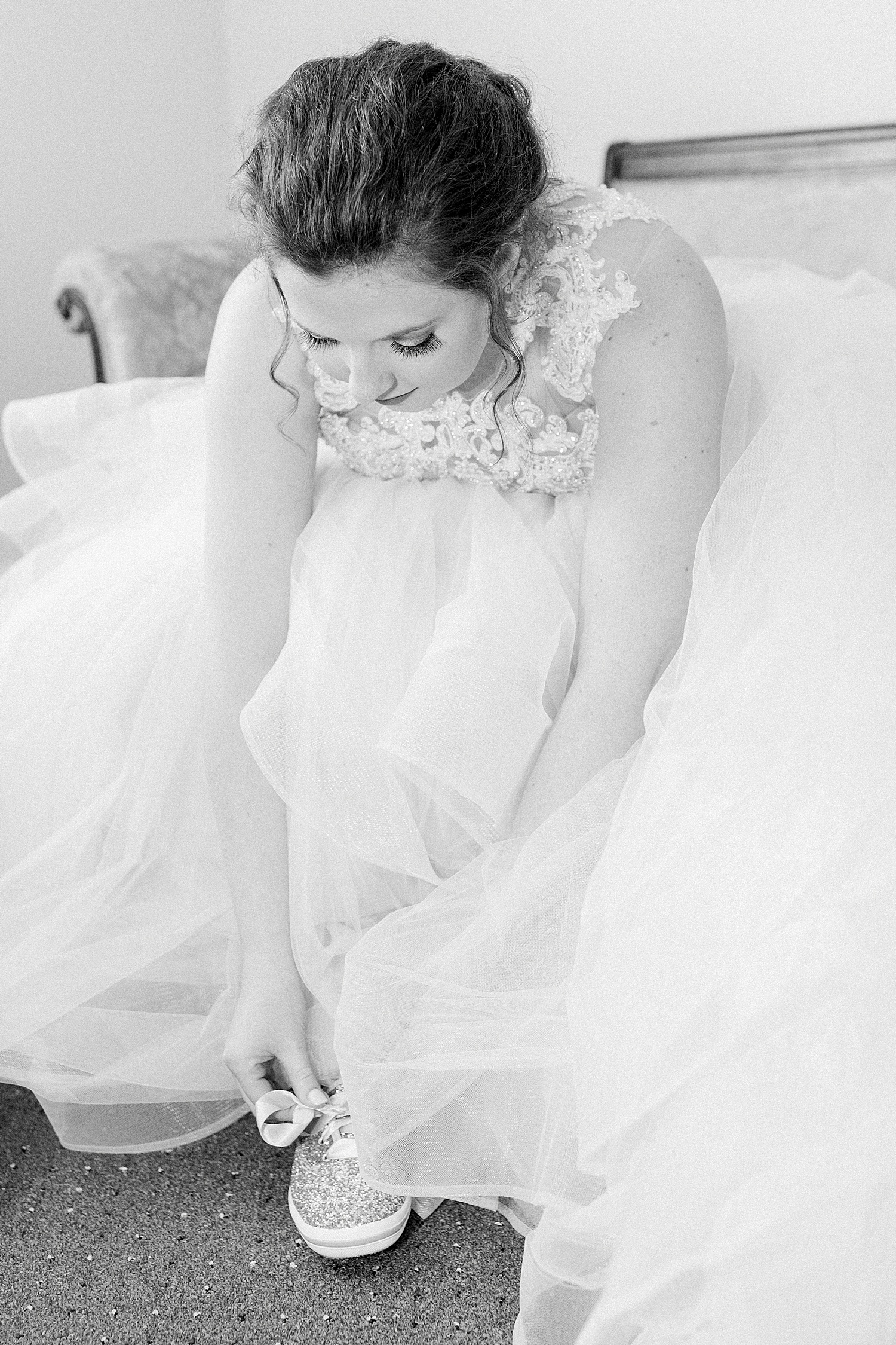 bride putting shoes on before romantic Tangarray AL Wedding Ceremony in Eclectic Alabama
