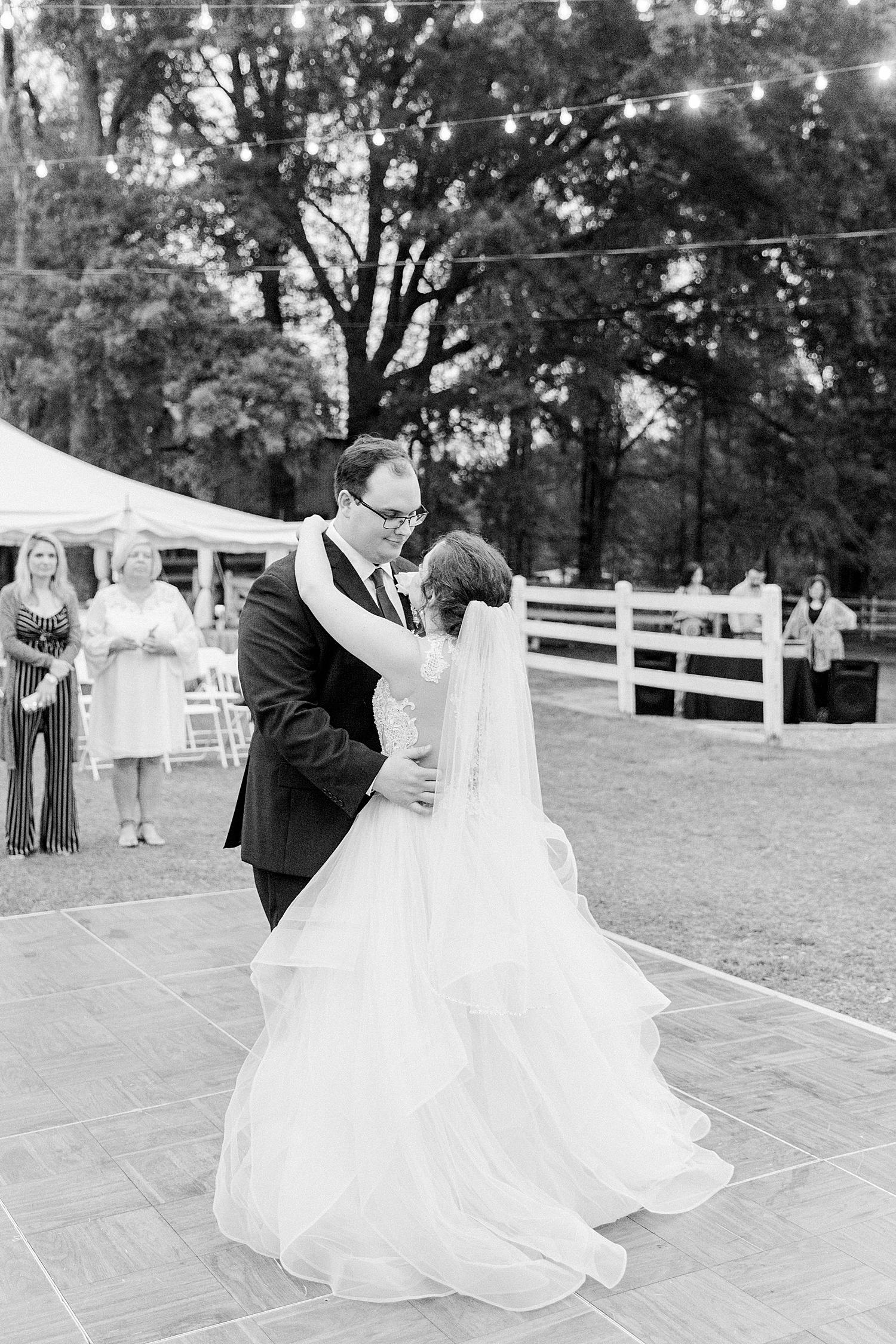 couple dance outside wedding reception