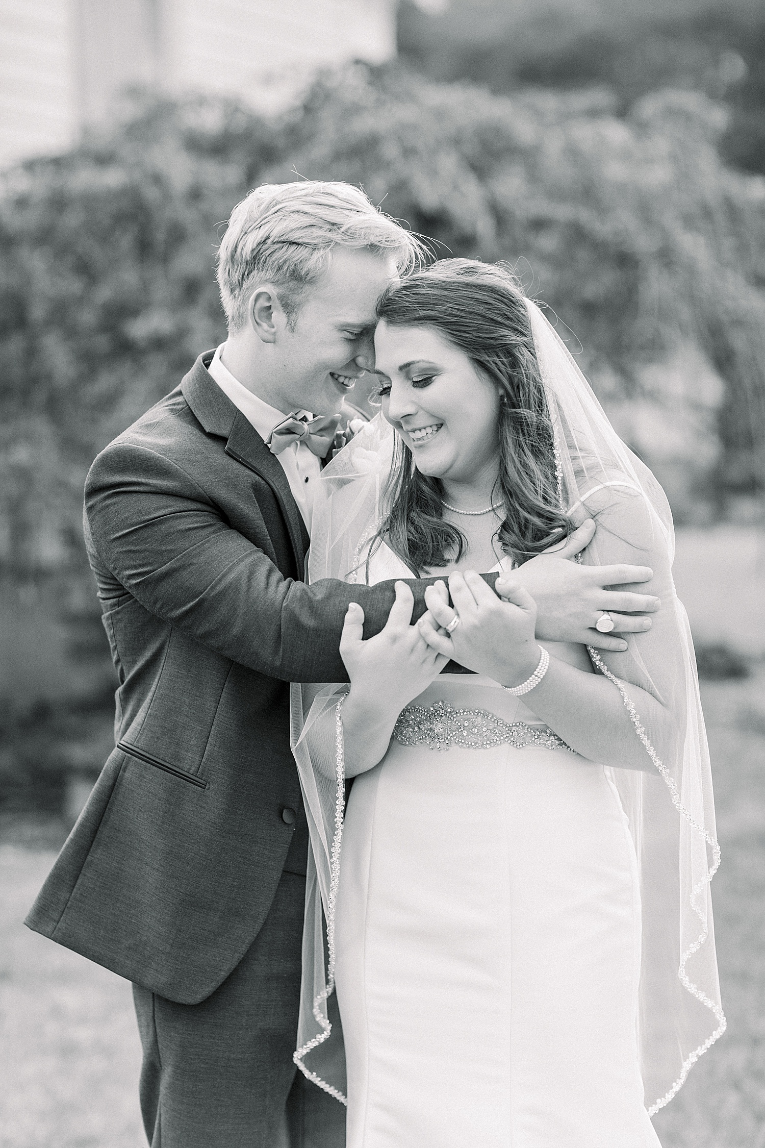 candid moment of couple hugging after wedding ceremony