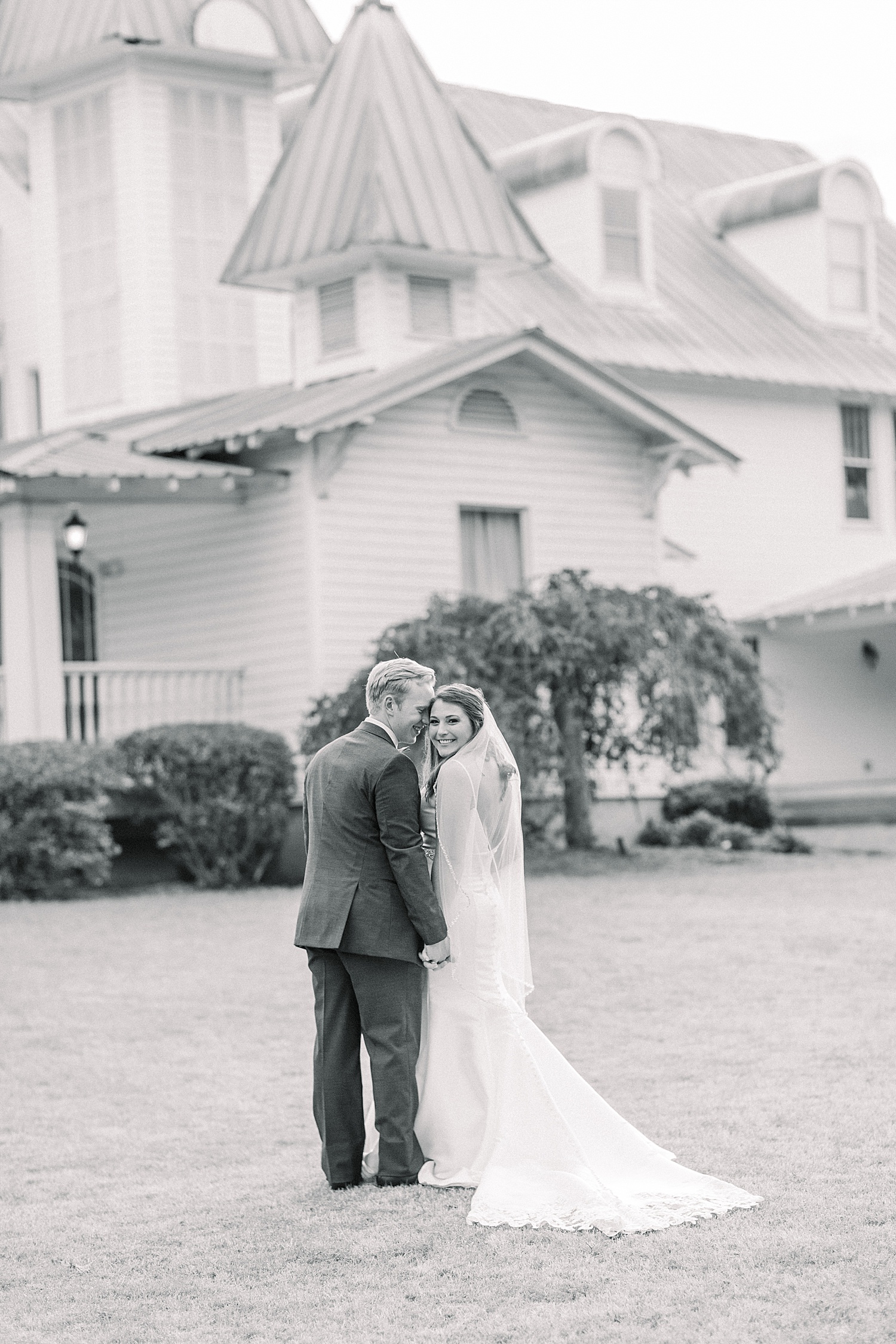 bride and groom portraits in front of wedding venue