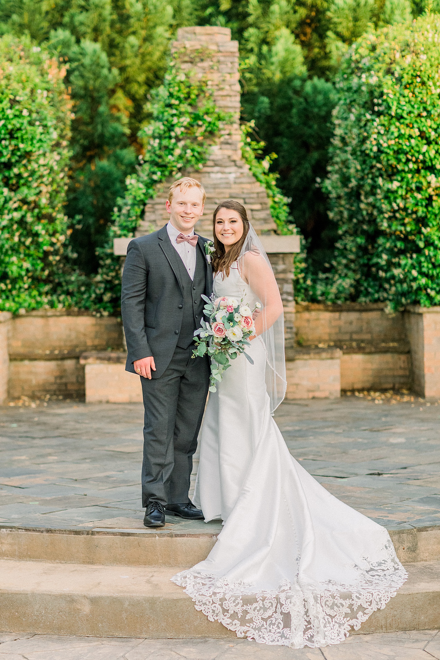 newlyweds pose at the courtyard of The Sonnet House in Alabama