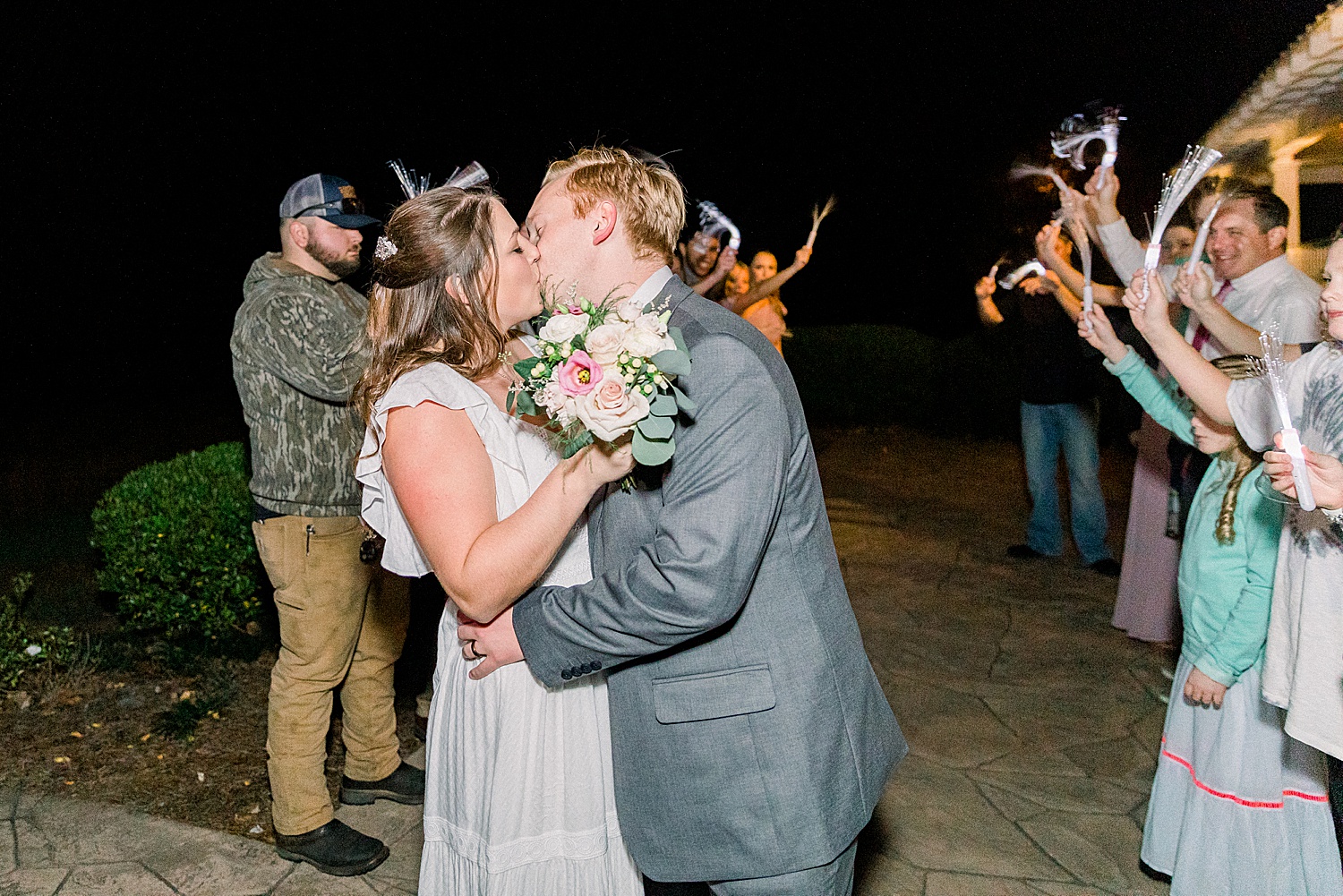 newlyweds kiss at the end of their wedding night