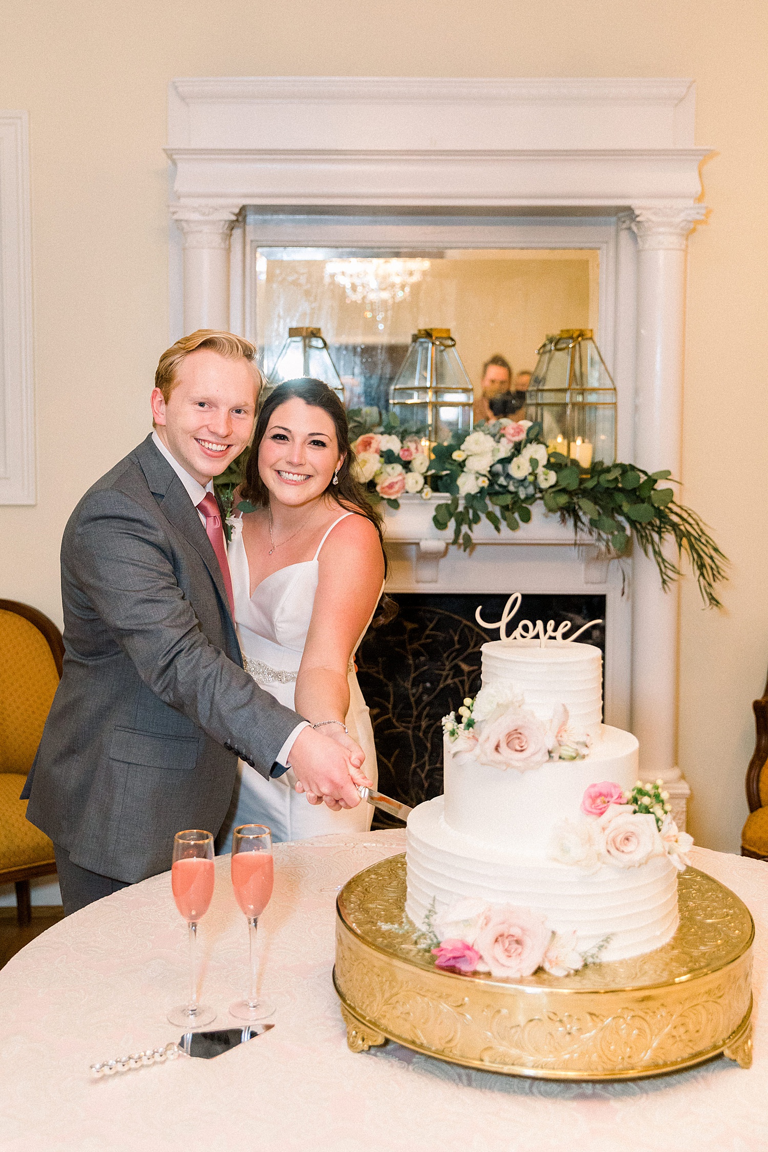 husband and wife cut their wedding cake