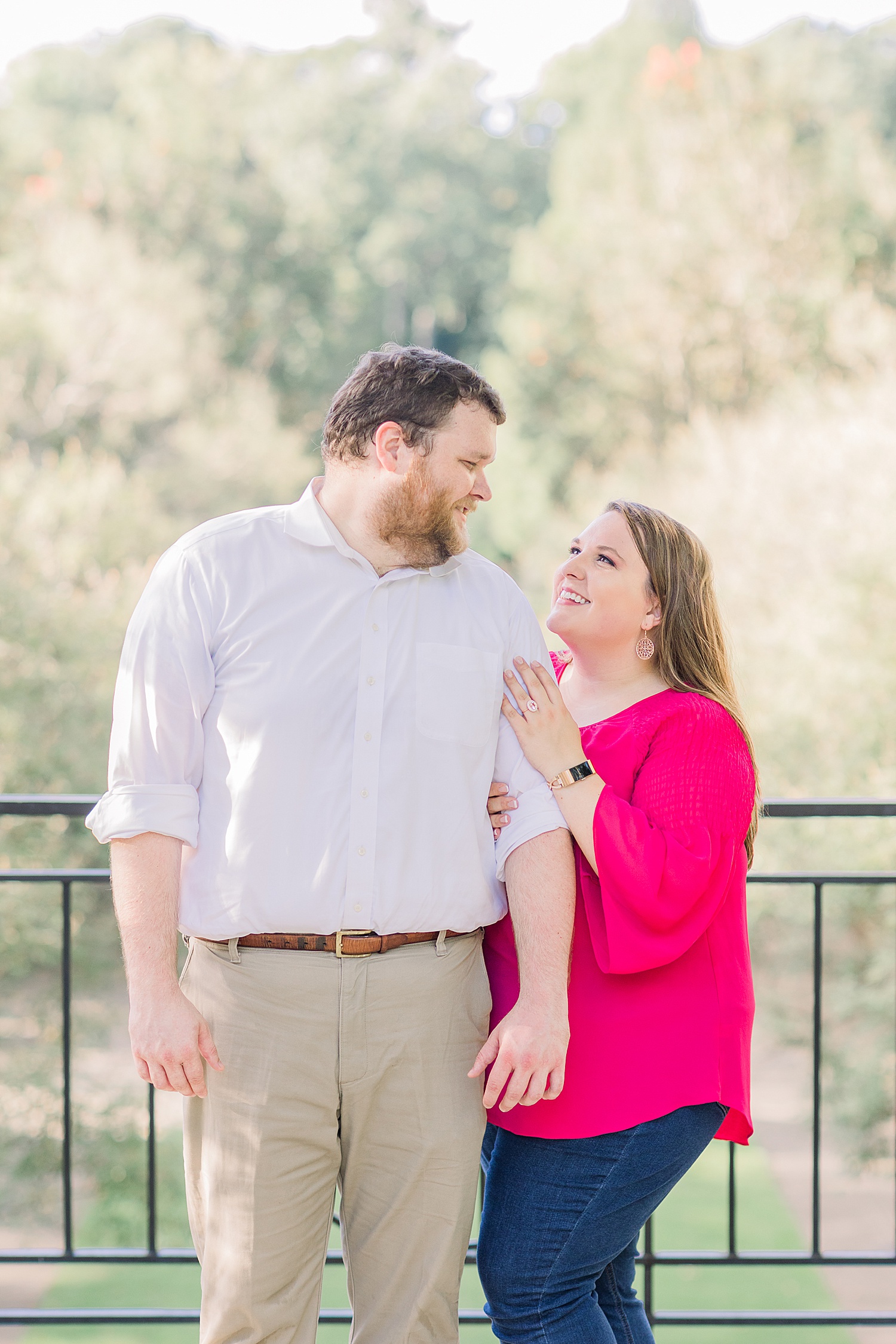 couple on balcony at Botanical Gardens for engagement sessions