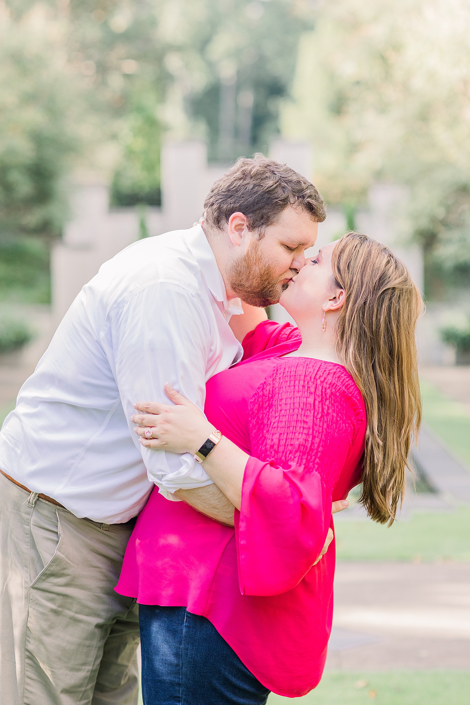 couple kiss during Birmingham Alabama Engagement at the Botanical Gardens -Birmingham Alabama Engagement Sessions
