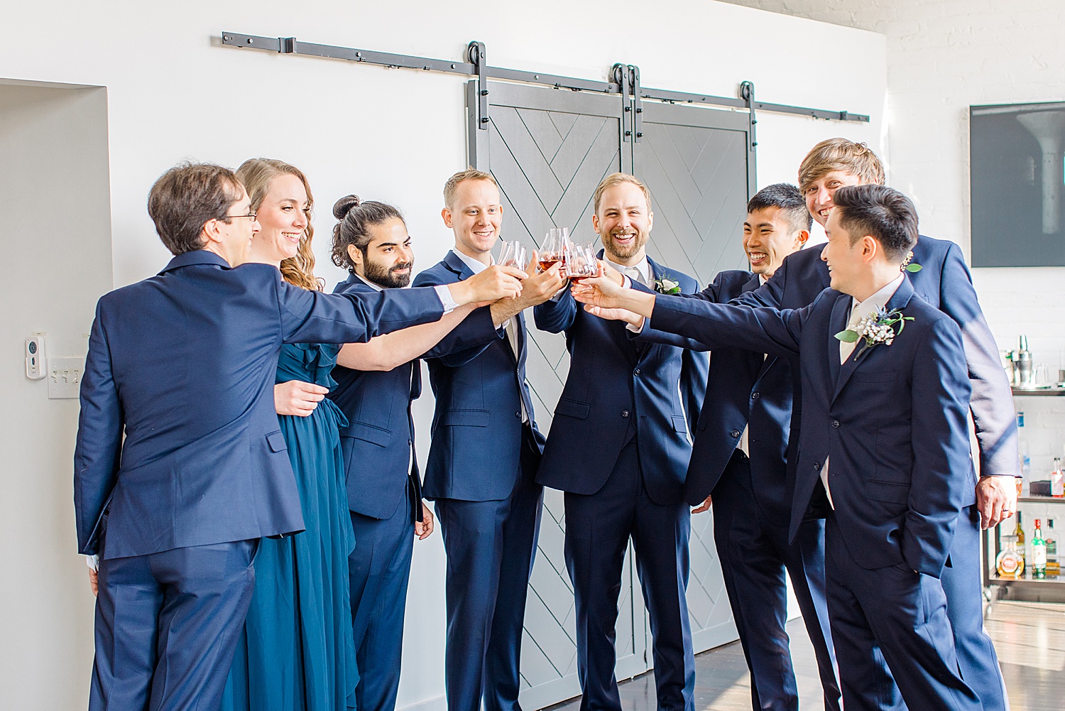 groomsmen all toast the groom before Florentine Building Fall Wedding ceremony