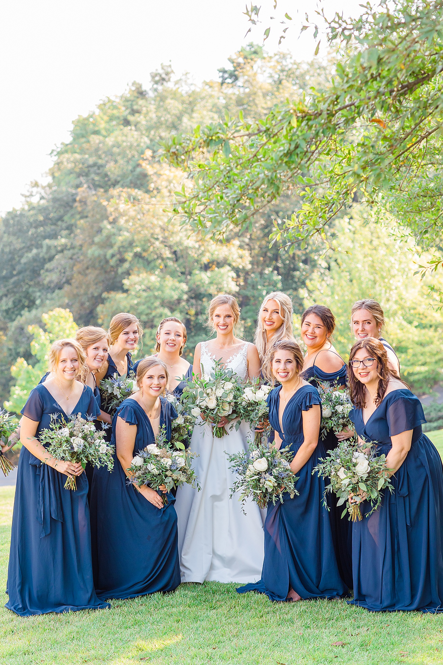 bride and bridesmaids stand outside for portraits