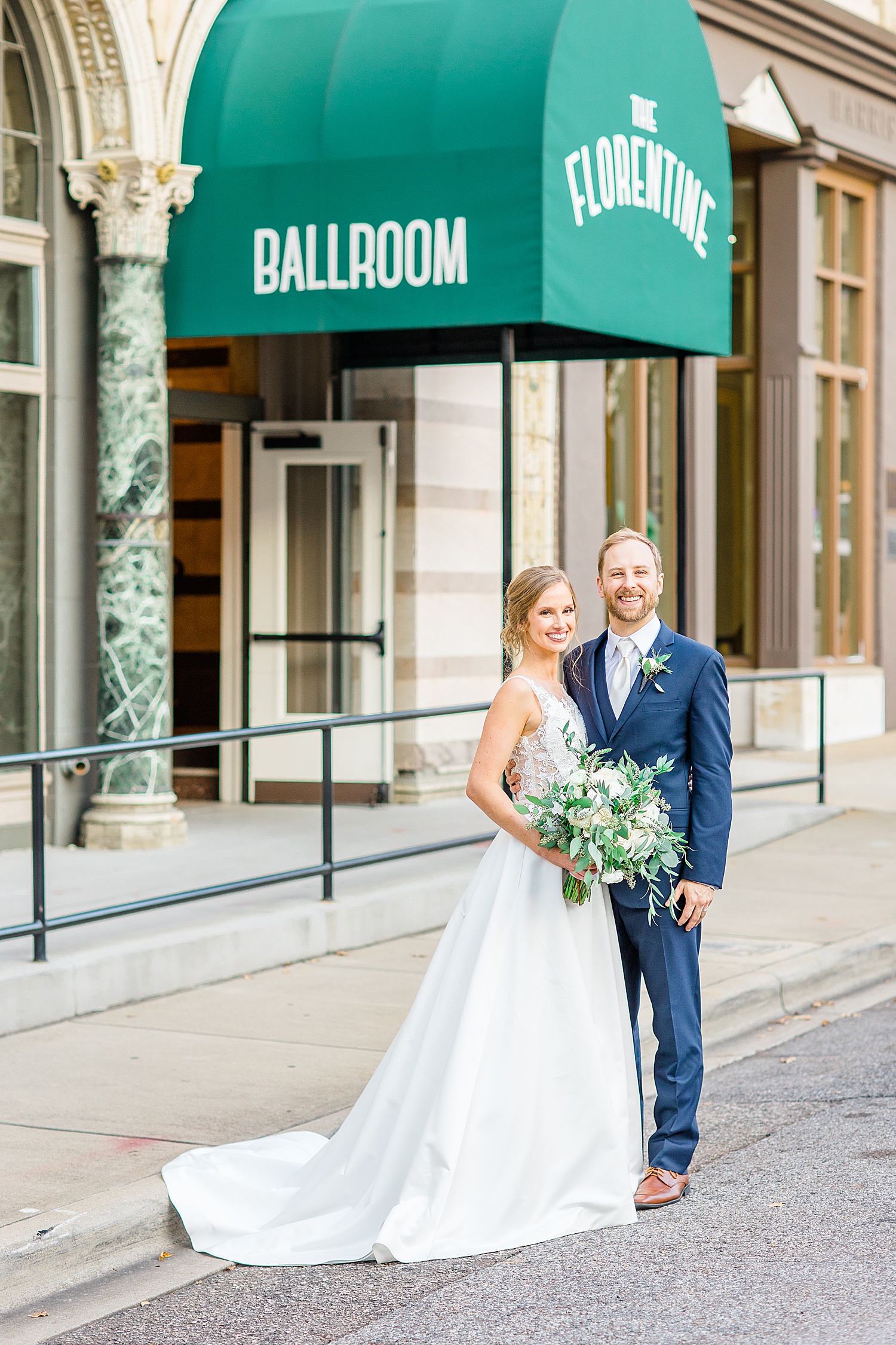 husband and wife standing outside The Florentine Building in Birmingham, AL