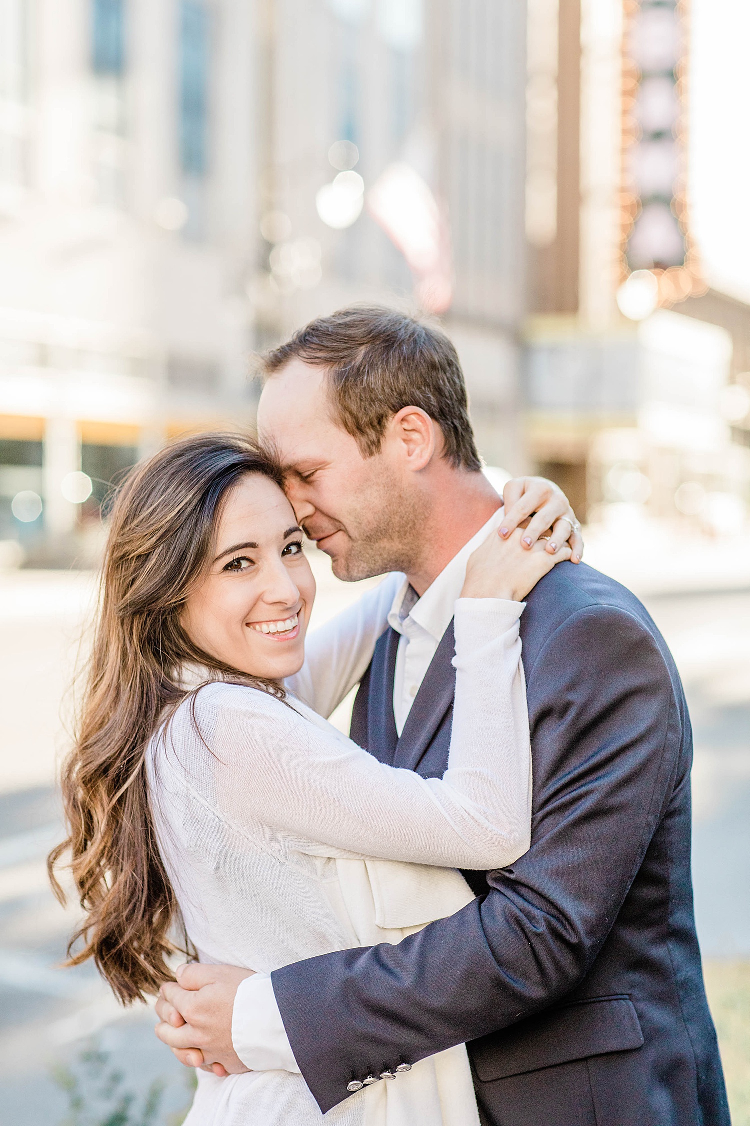 couple with heads together during engagement session