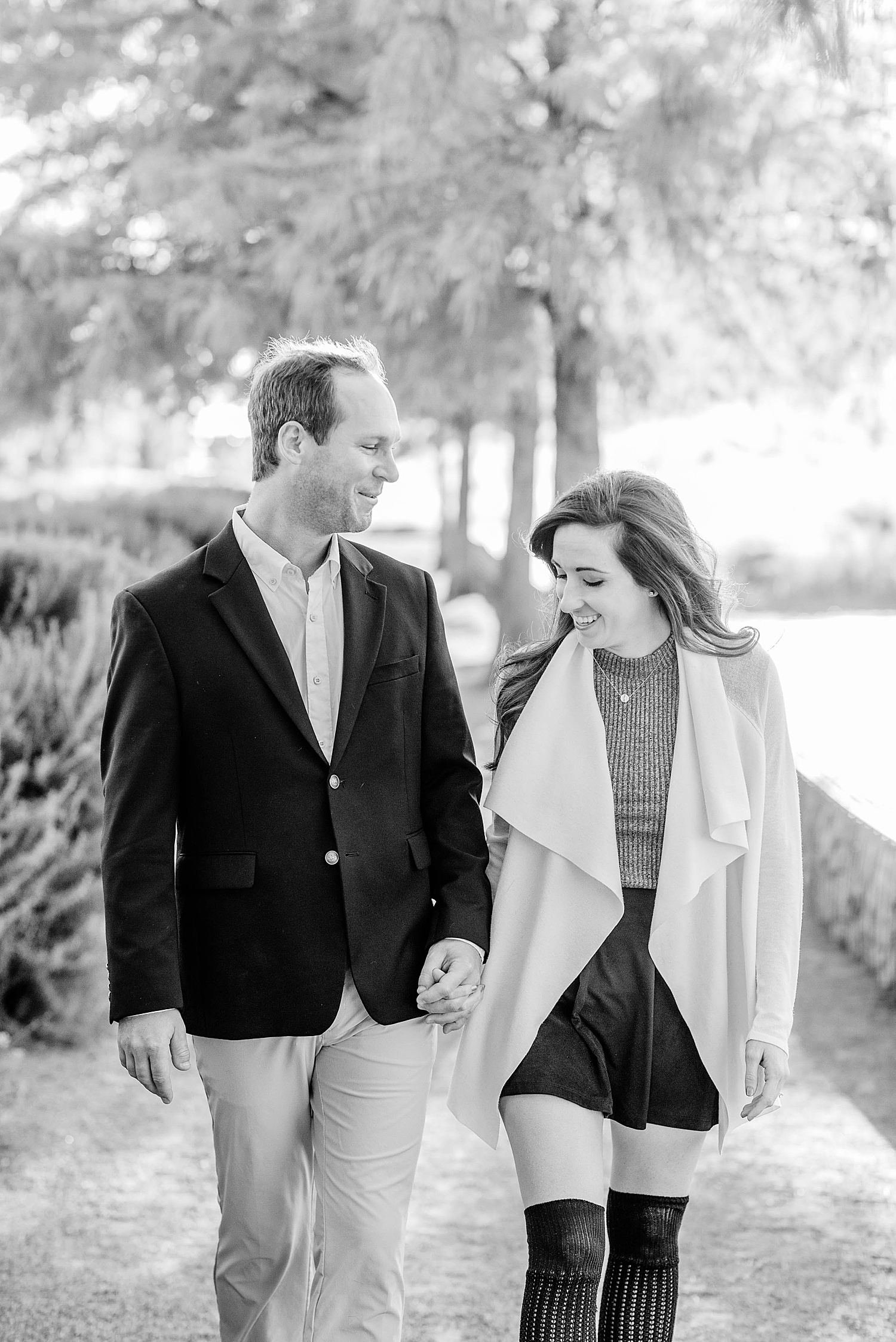 black and white photo of couple walking together in Downtown Birmingham Alabama Engagement Session