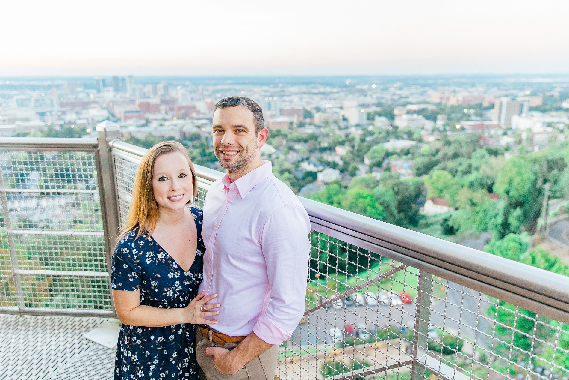 engaged couple on rooftop during Al engagement photos