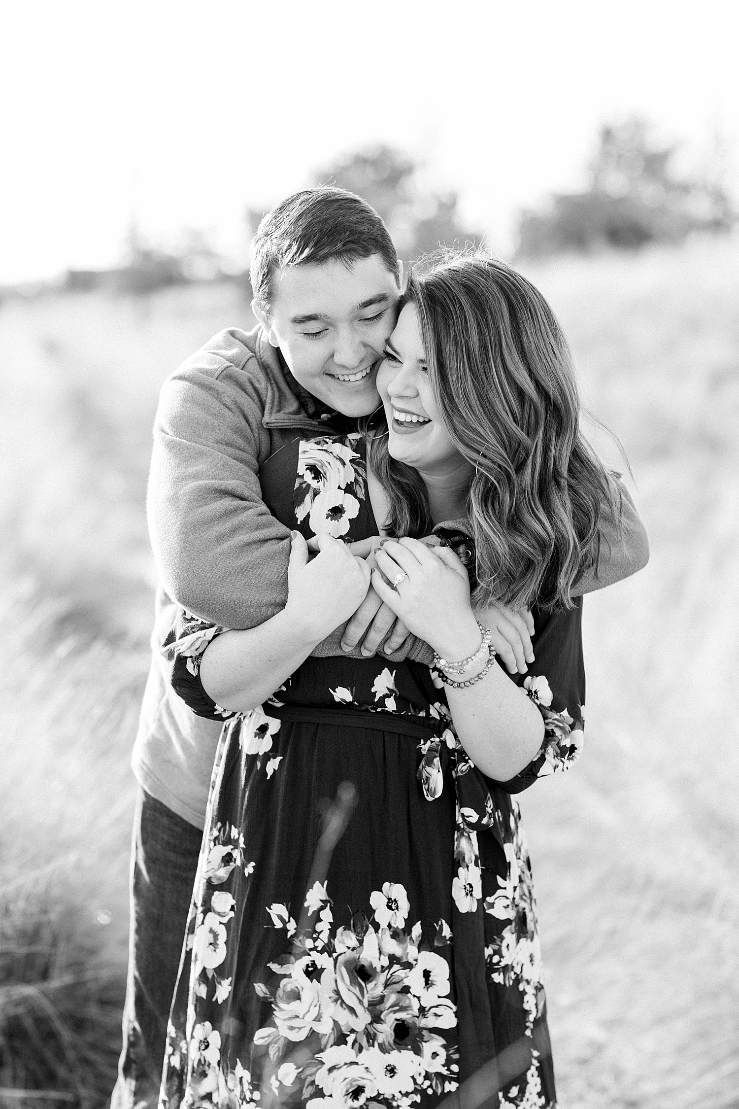 couple share laughs during their engagement session