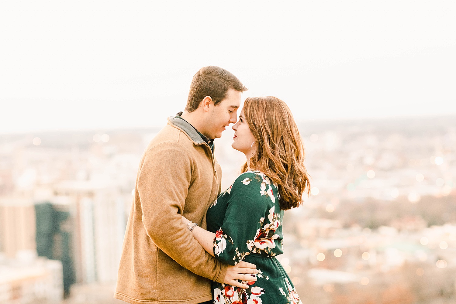 Downtown Birmingham AL Engagement Portraits with the cityscape in the background