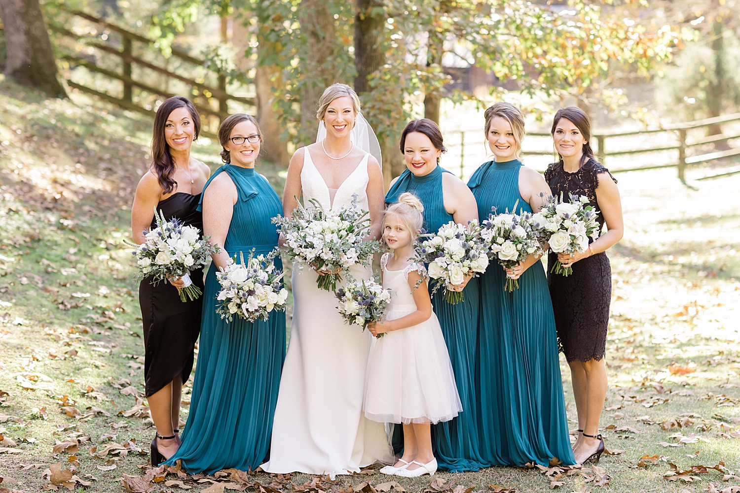 bride with bridesmaids and flower girl