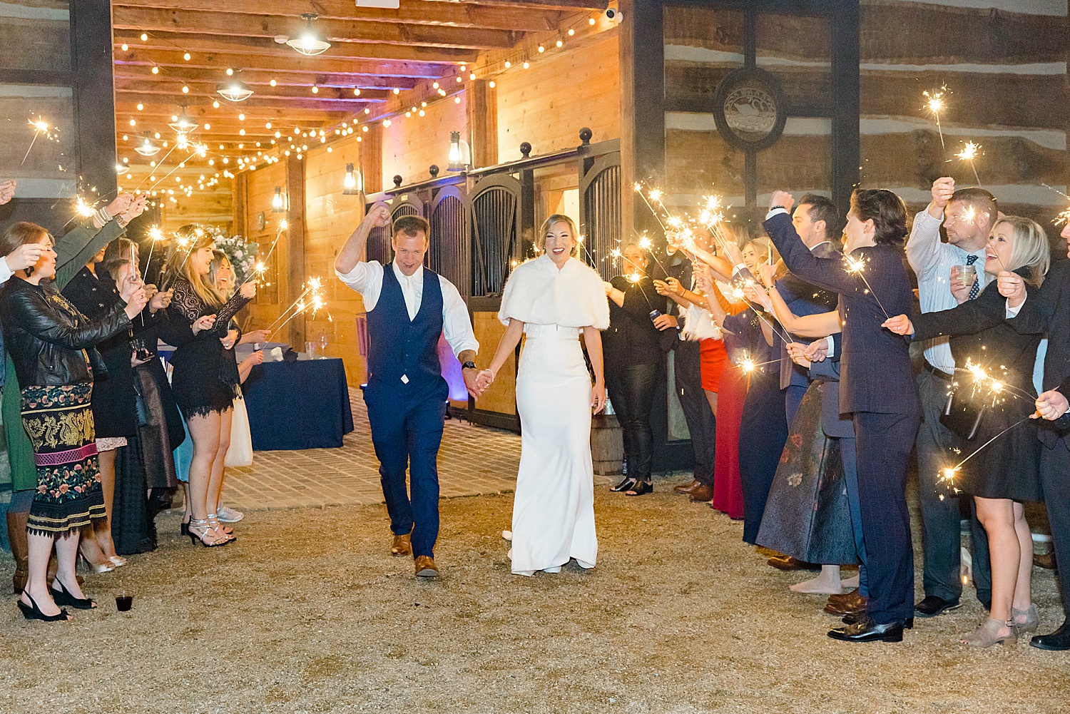 bride and groom exit with guests holding sparklers