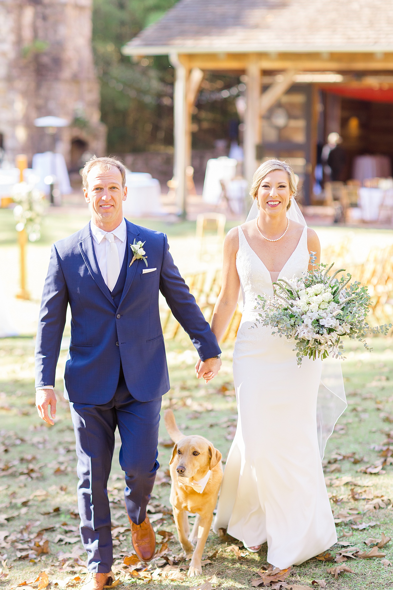bride and groom after wedding ceremony with their dog
