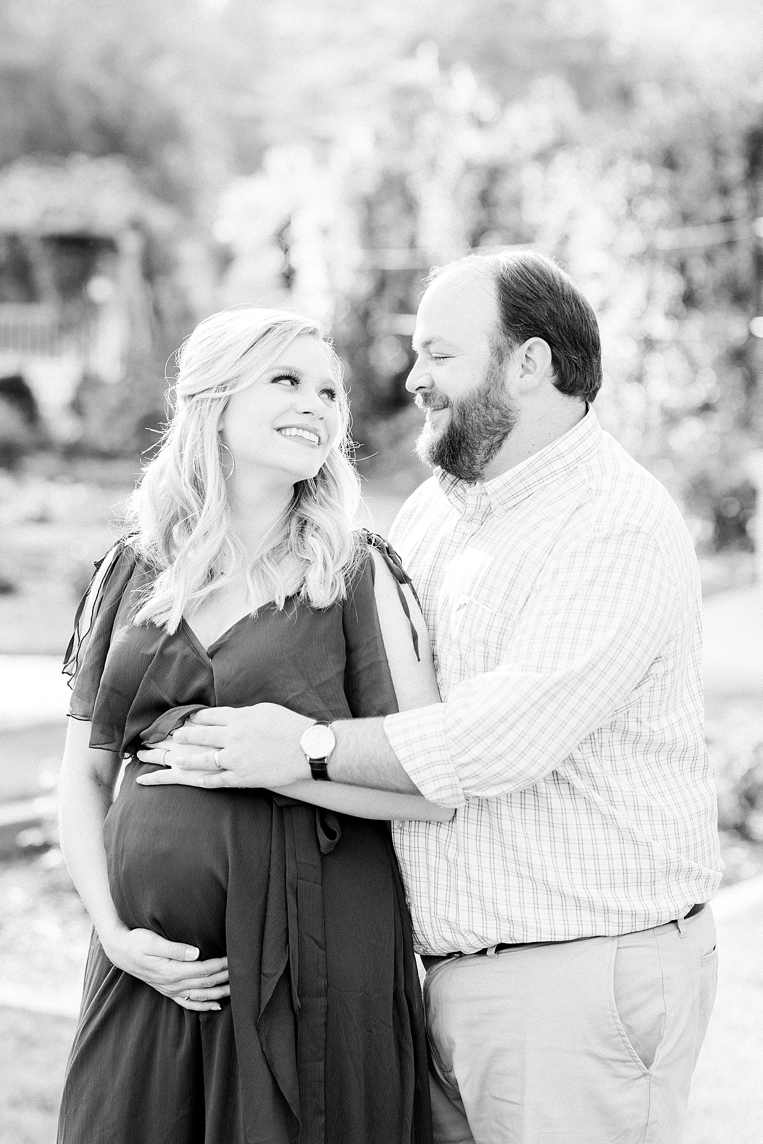 black and white photo of expectant couple