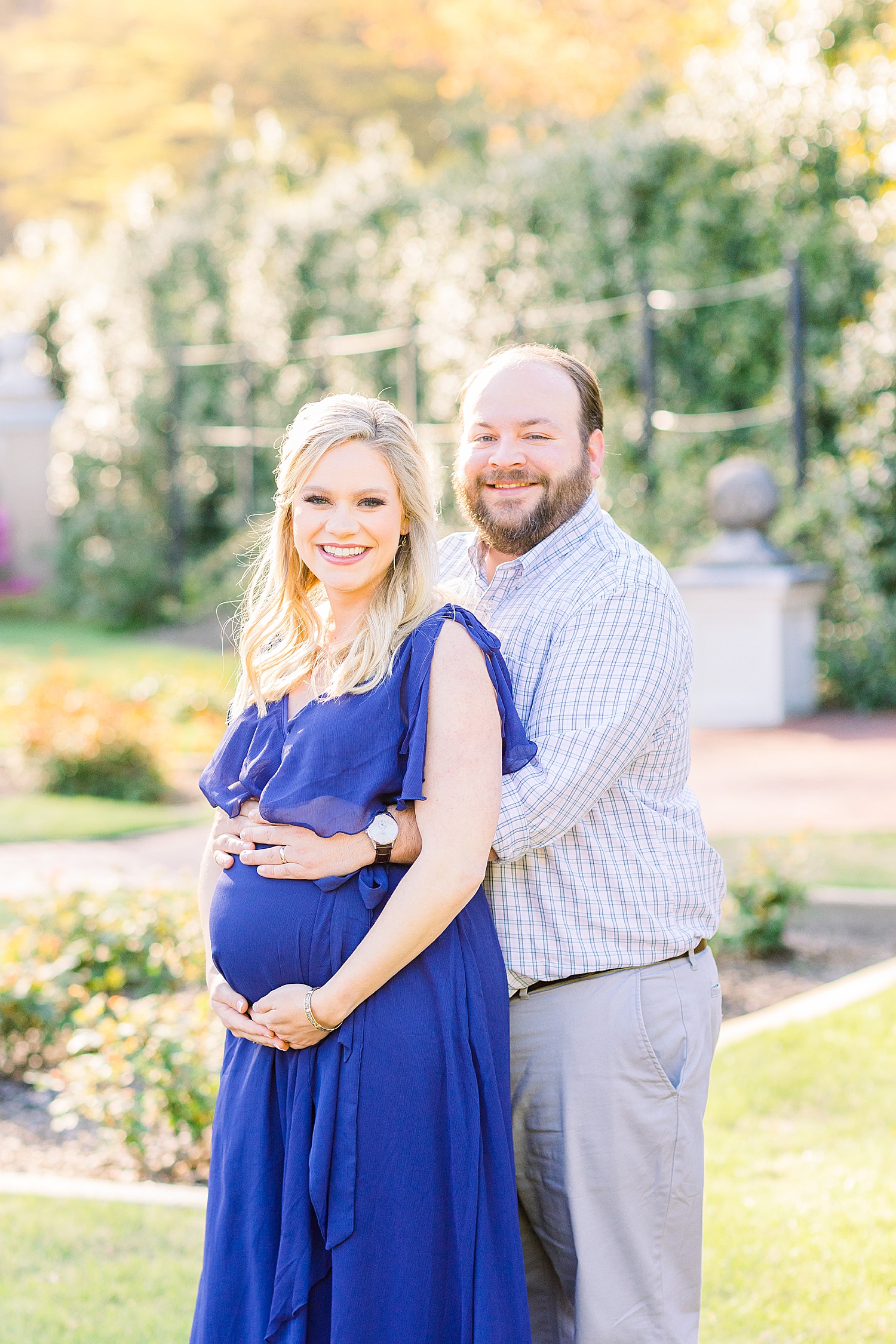 couple stand in Birmingham Botanical Gardens during Maternity Session