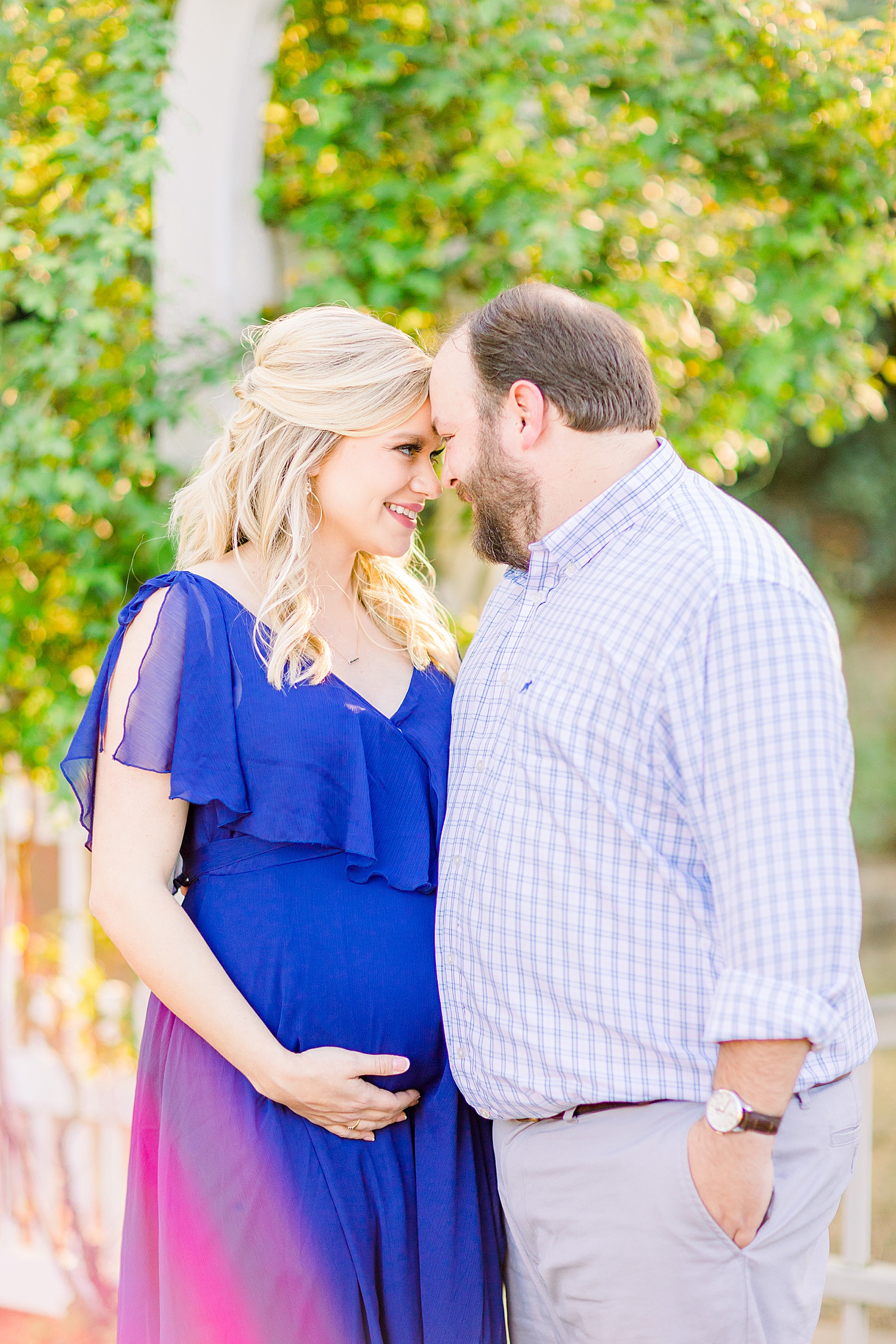 couple lean in together during Birmingham AL Maternity Session