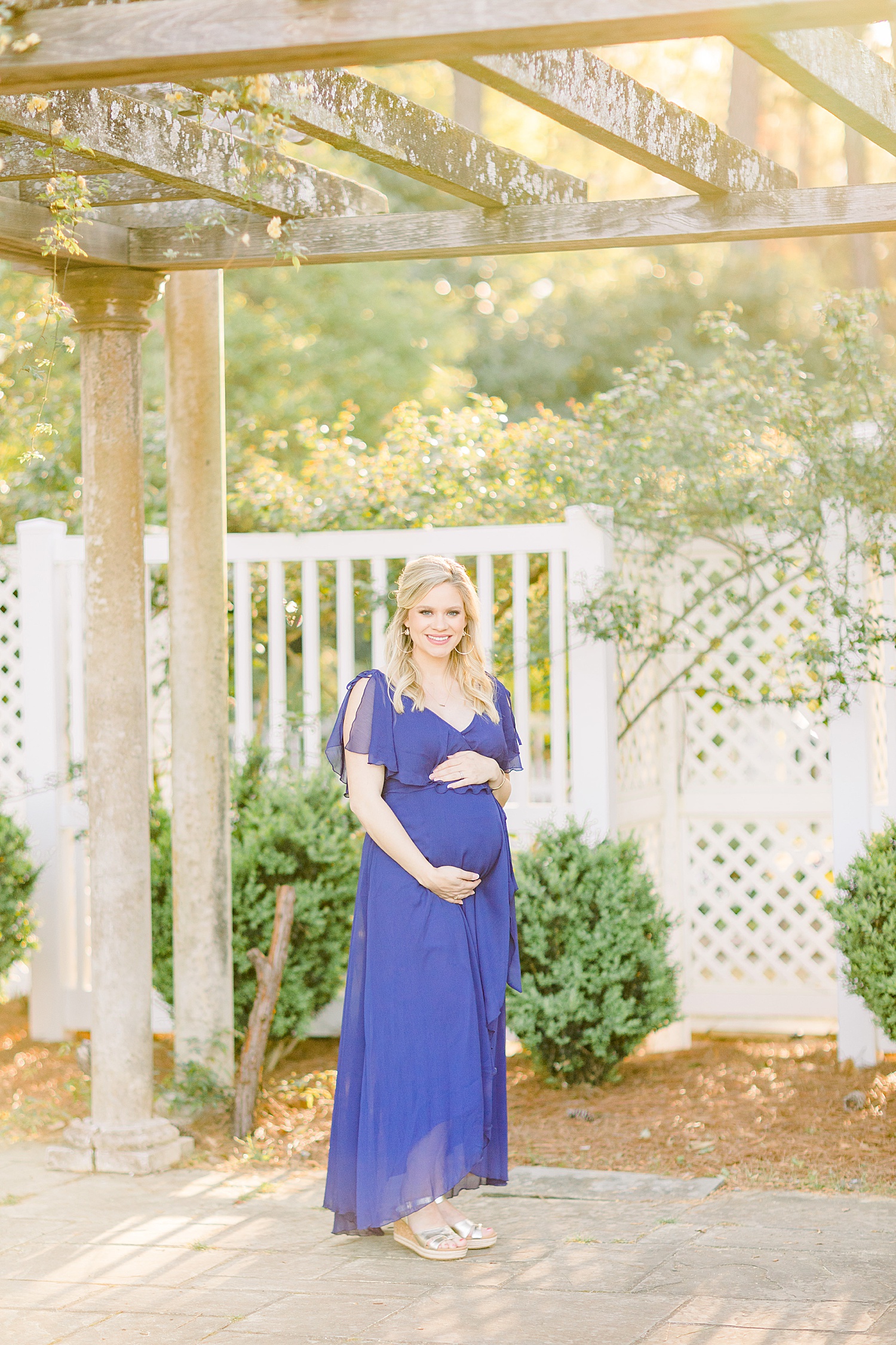 maternity session of expectant mom in blue dress