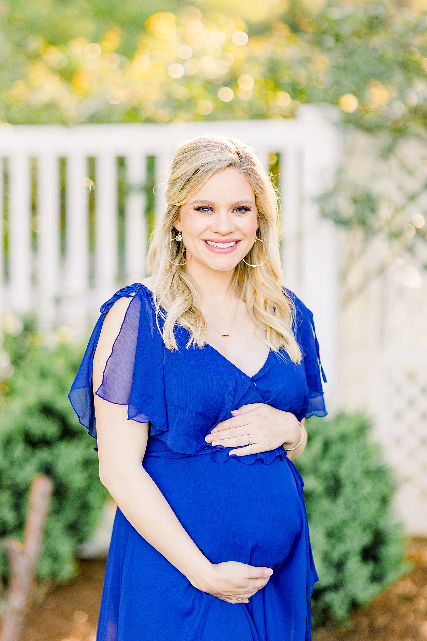 glowing mom to be during maternity session in downtown Birmingham AL