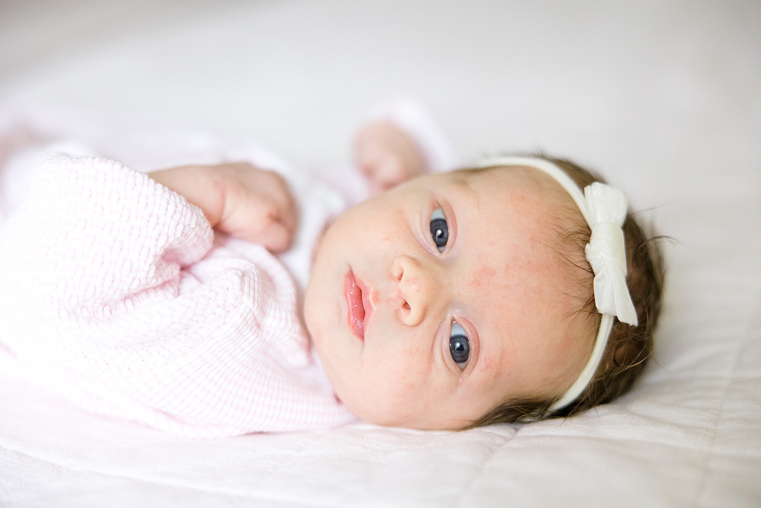 newborn girl with white headband