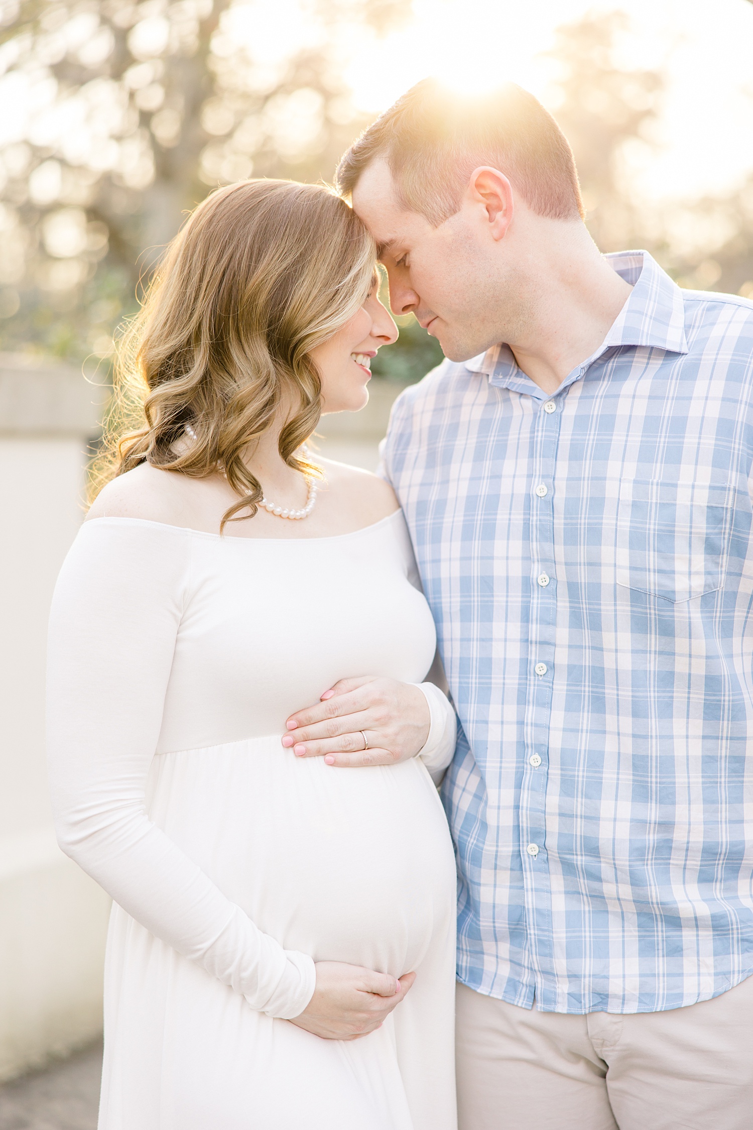 husband and wife during maternity photo session