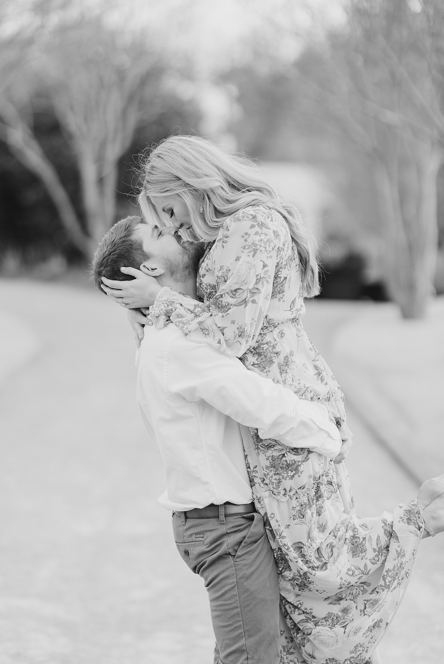 engaged couple kiss during Downtown Birmingham Engagement Photos