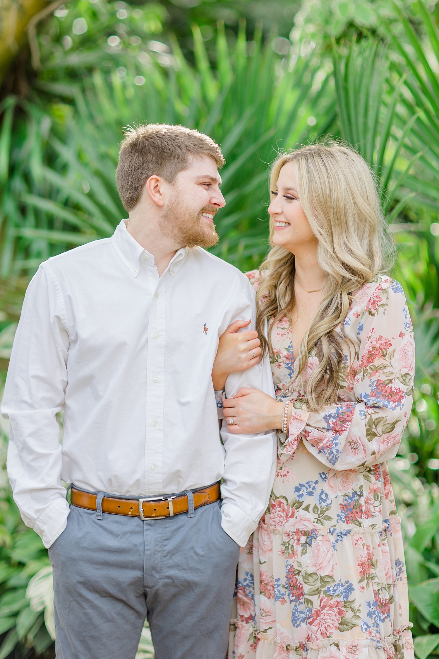 engaged couple look at each other during their Botanical Gardens engagement session