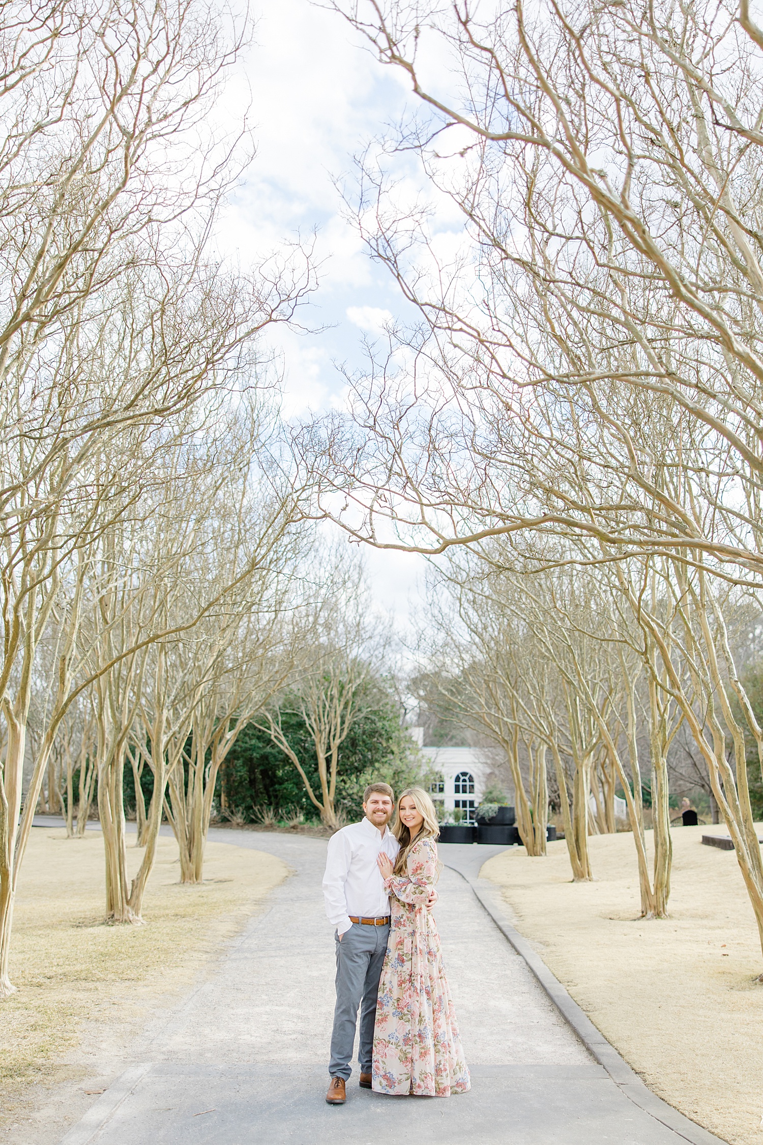 couple stand in the entrance of the Botanical Gardens during Birmingham AL Engagement Session