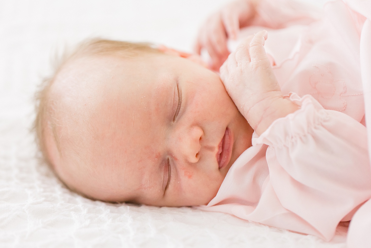 close up of baby girl during newborn sesion