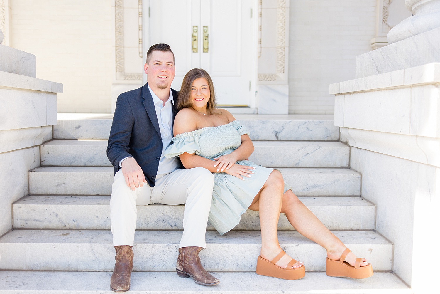 couple sitting on the steps of church in downtown Birmingham Al
