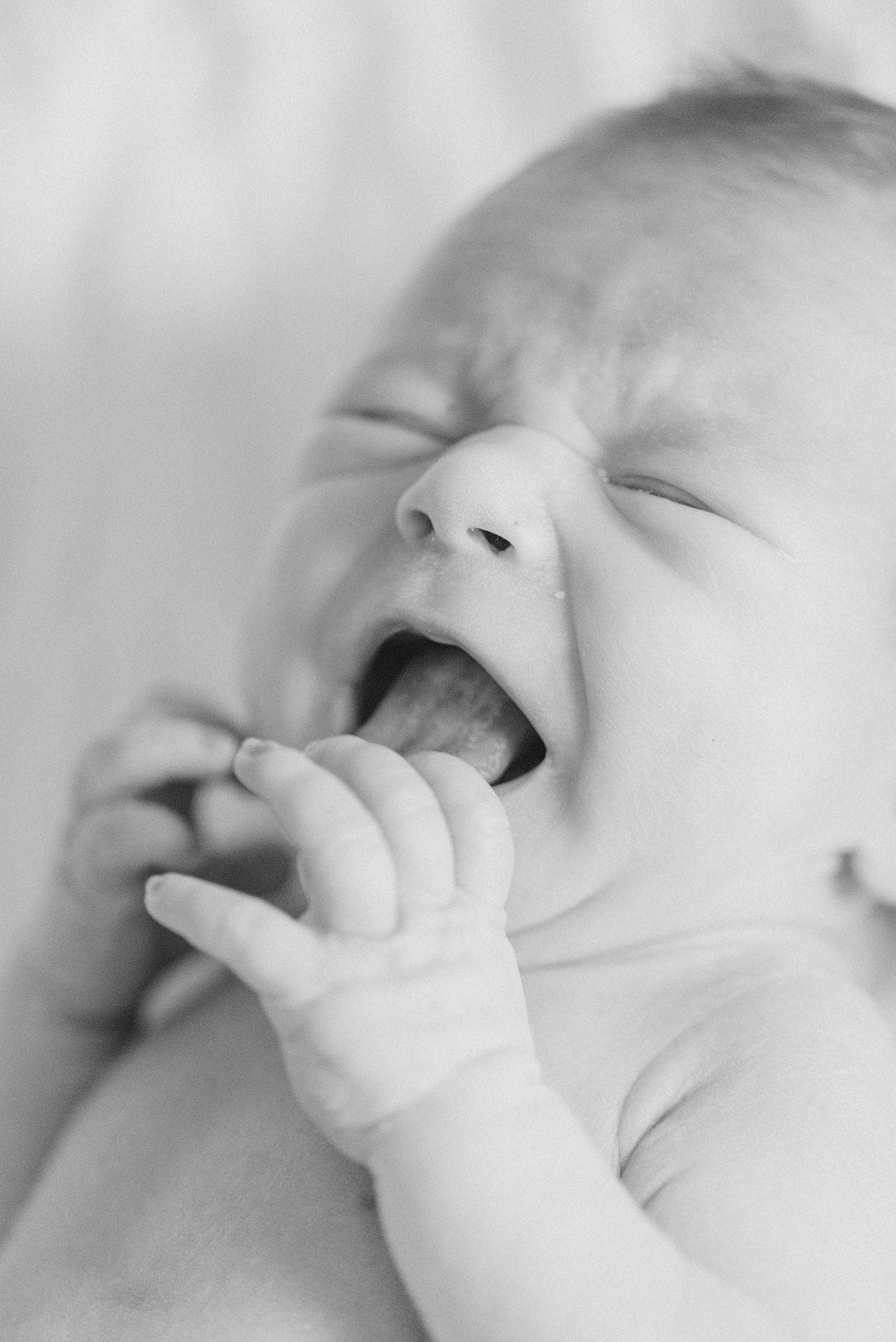 newborn cries during Birmingham In-Home Newborn Session