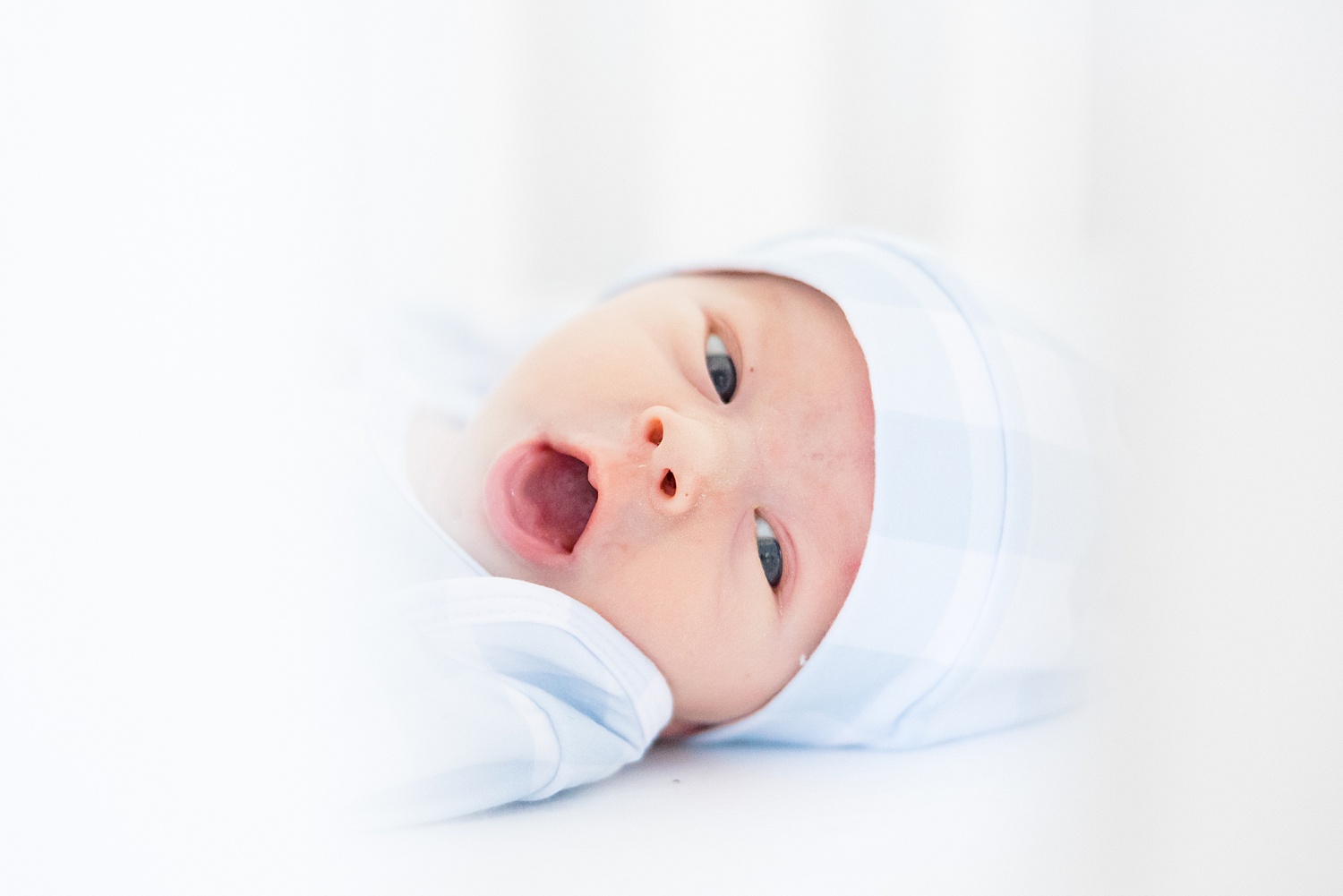 newborn gives a yawn during Birmingham In-Home Newborn Session