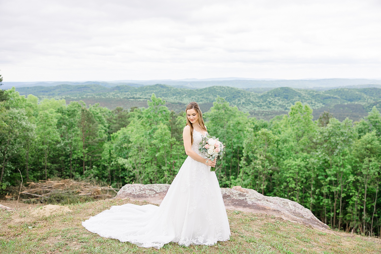 Birmingham AL wedding photographer captures bride on hilltop with a stunning natural landscape 